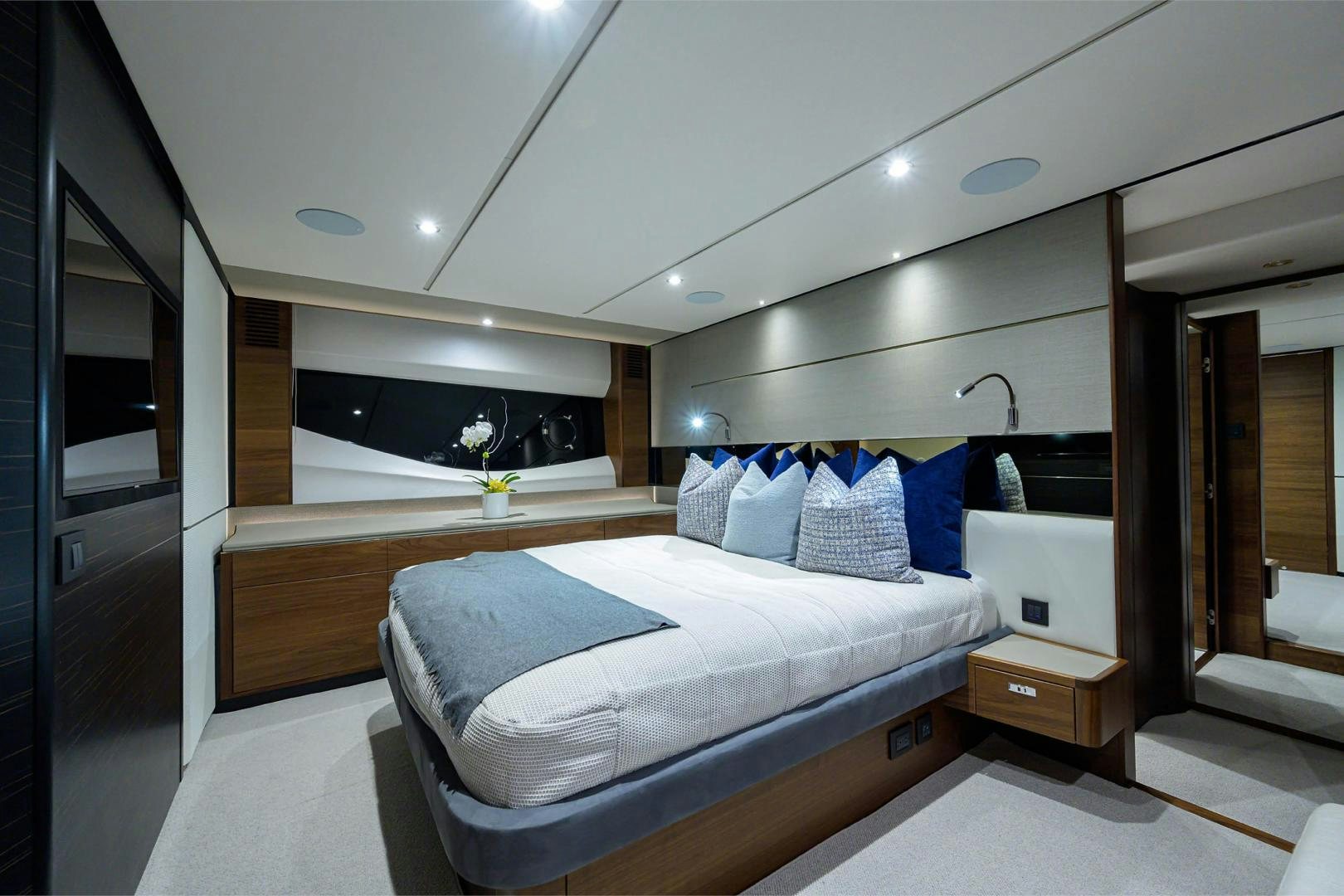a bedroom with a bed and a mirror aboard GREAT NEWS Yacht for Sale