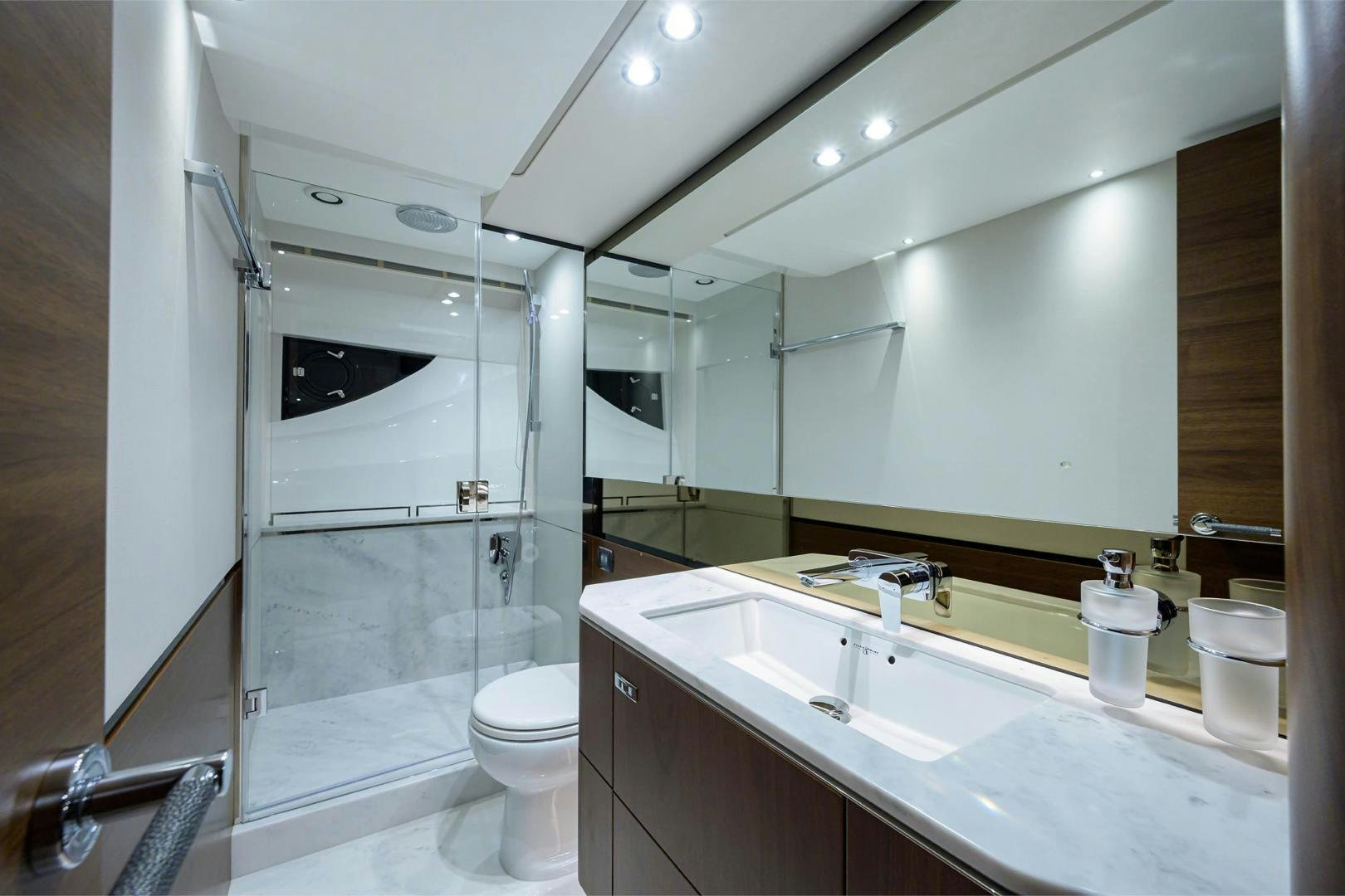 a bathroom with a large mirror aboard GREAT NEWS Yacht for Sale