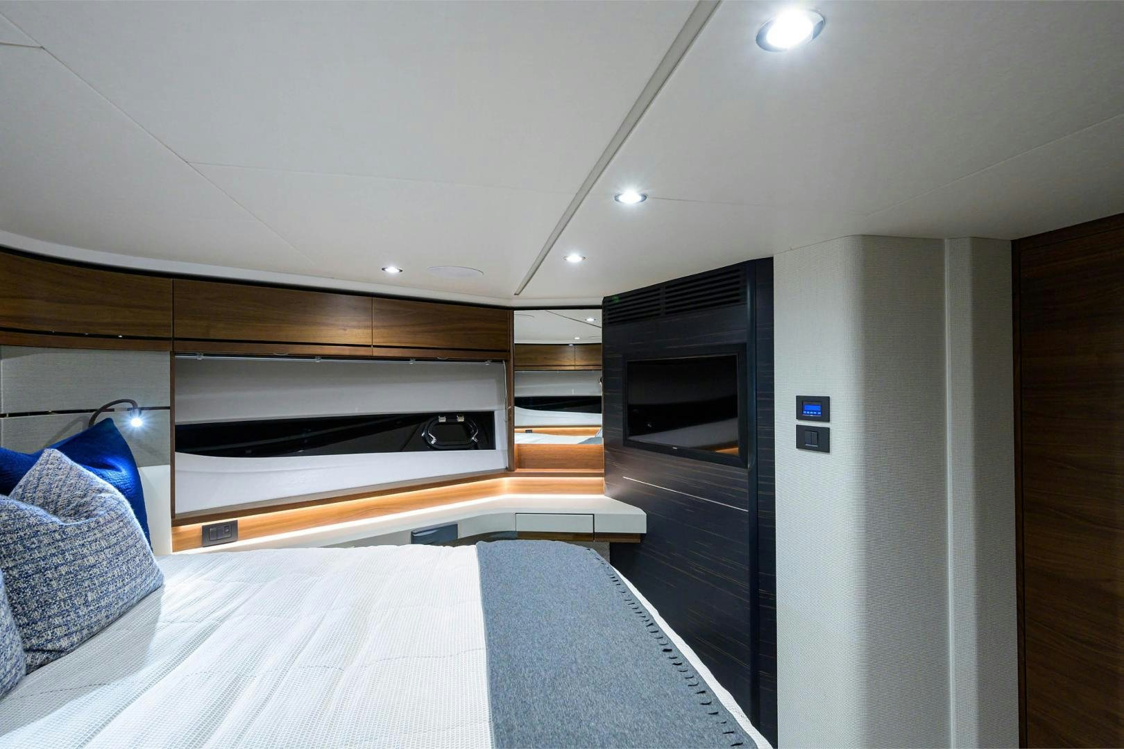 a bedroom with a bed and a television aboard GREAT NEWS Yacht for Sale