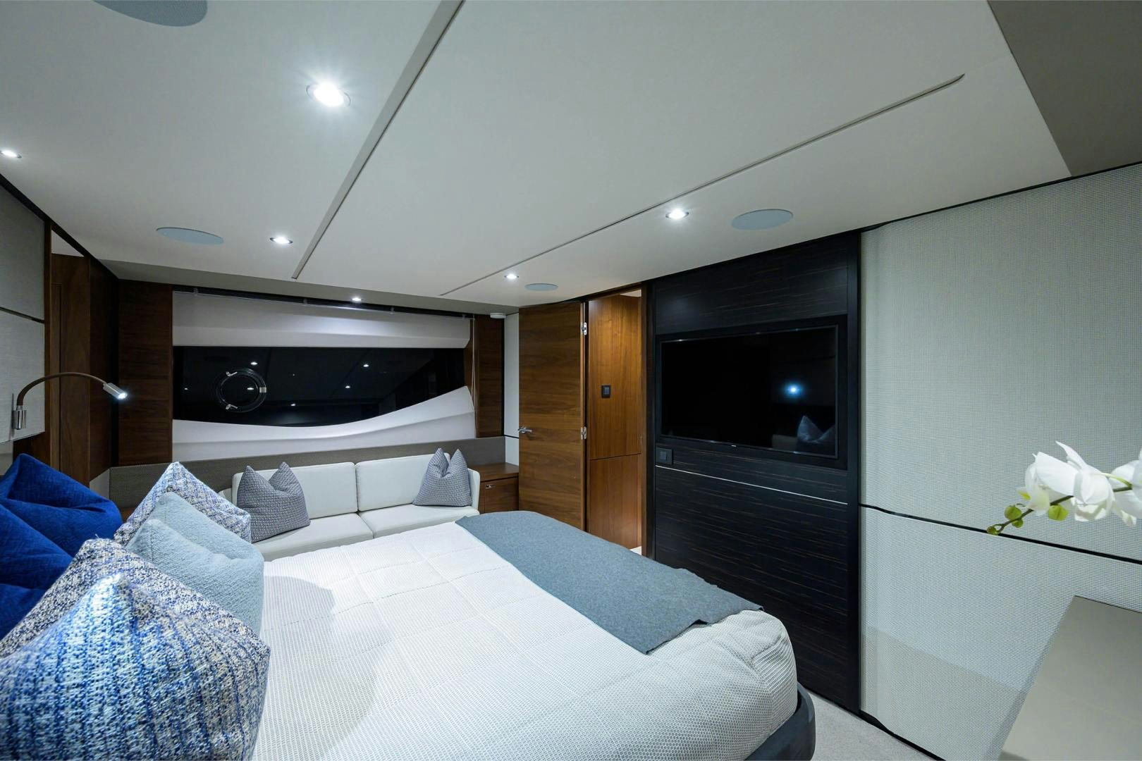 a bedroom with a bed and a television aboard GREAT NEWS Yacht for Sale