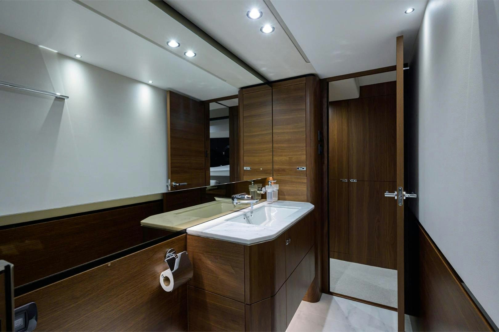 a bathroom with a sink and a mirror aboard GREAT NEWS Yacht for Sale