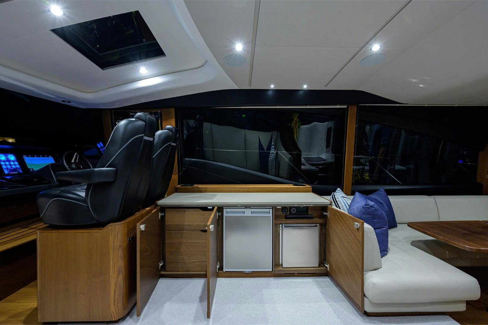 a room with a desk and chairs aboard GREAT NEWS Yacht for Sale