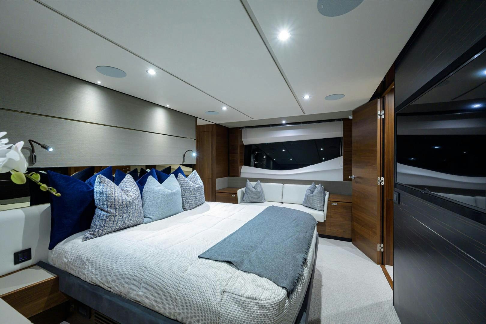 a room with a bed and a wood door aboard GREAT NEWS Yacht for Sale