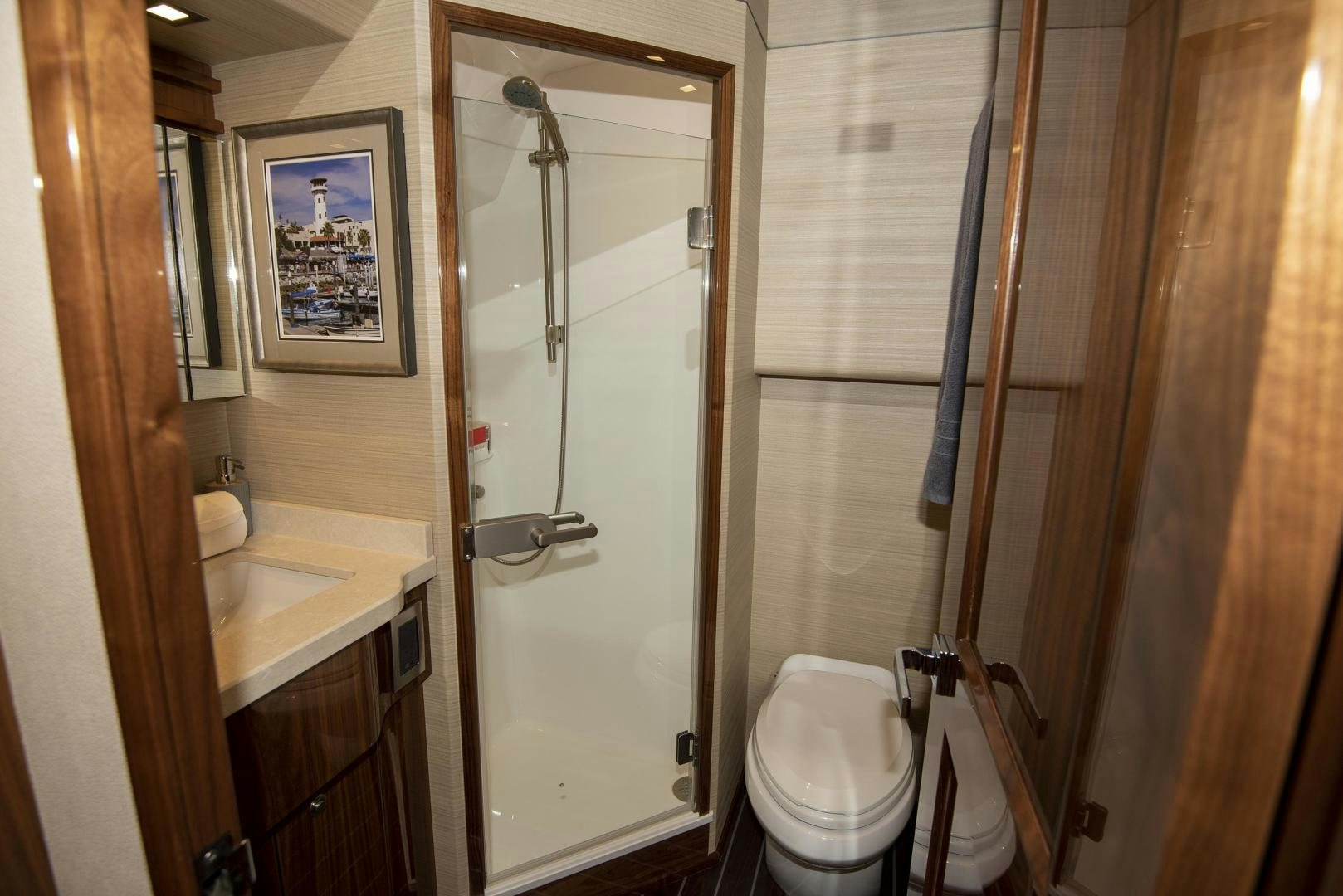 a bathroom with a toilet and sink aboard TAG TEAM Yacht for Sale