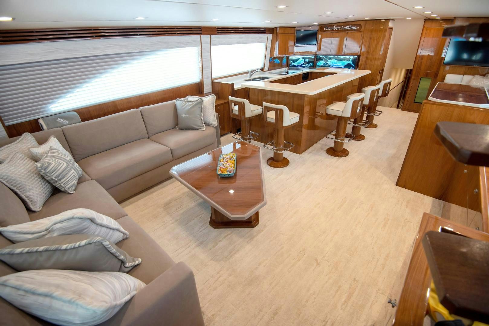 a living room with a couch and a table aboard TAG TEAM Yacht for Sale