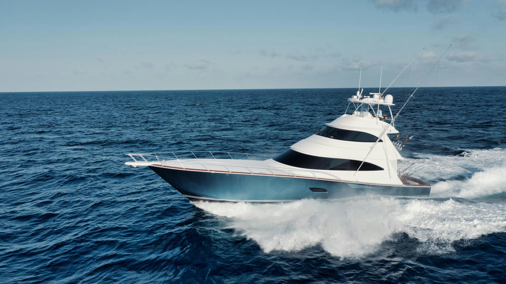 a white boat on the water aboard TAG TEAM Yacht for Sale