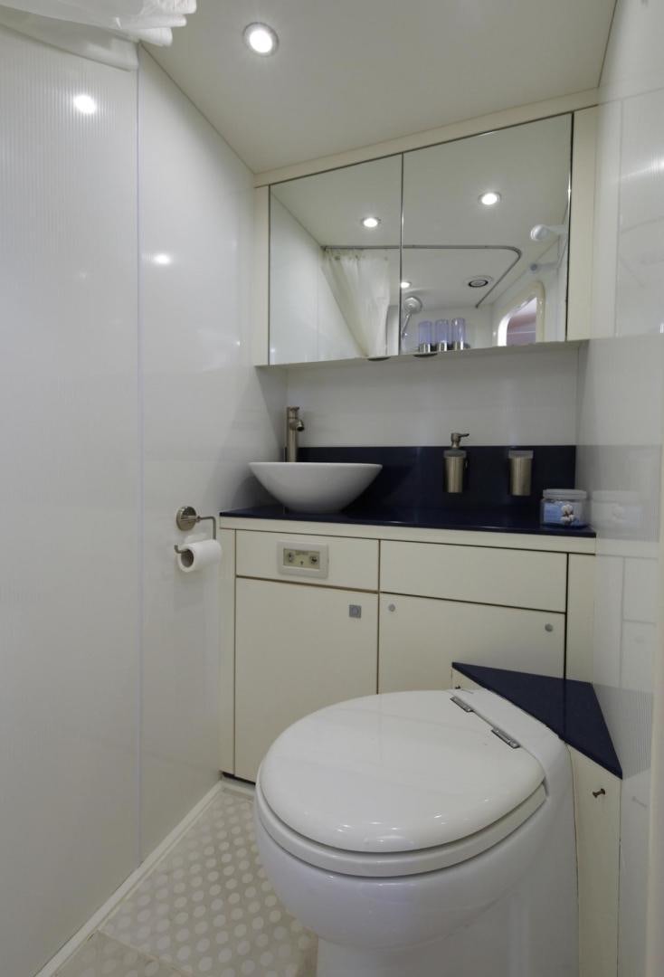 a bathroom with a sink and a toilet aboard SEA C Yacht for Sale