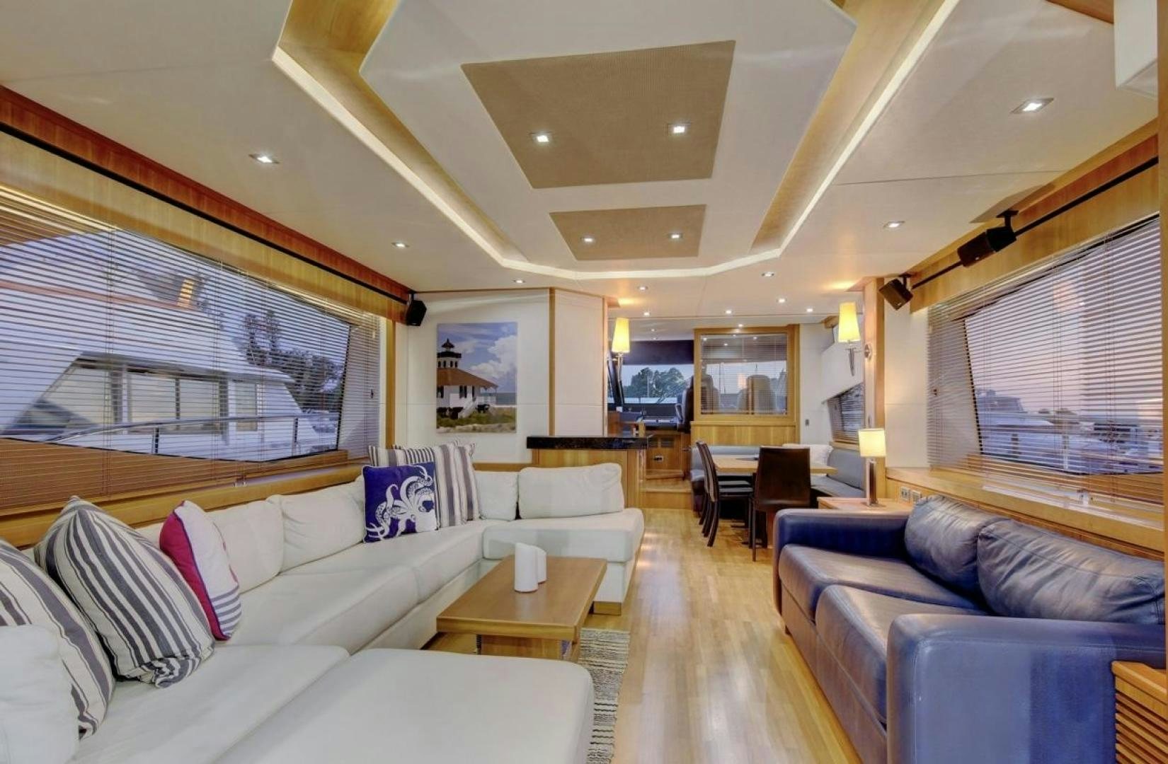 a living room with a large window aboard SEA C Yacht for Sale