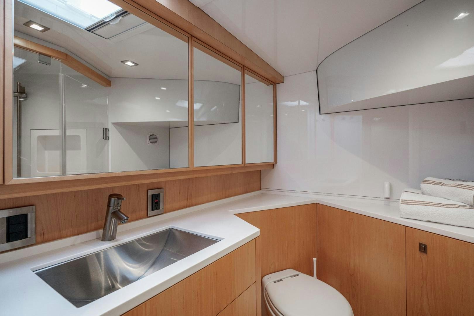 a bathroom with a sink and a toilet aboard MY CAT Yacht for Sale
