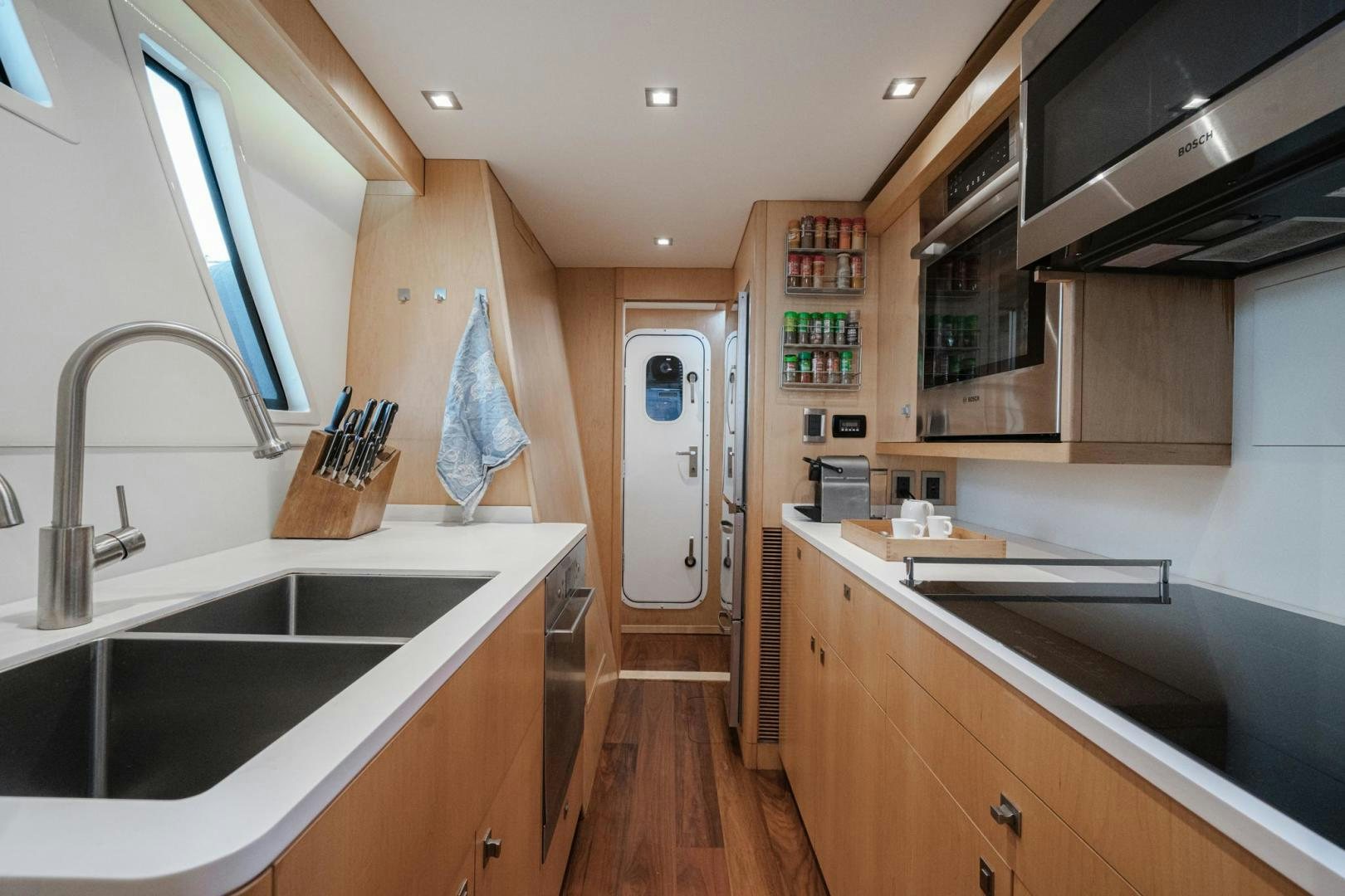 a kitchen with a sink and cabinets aboard MY CAT Yacht for Sale