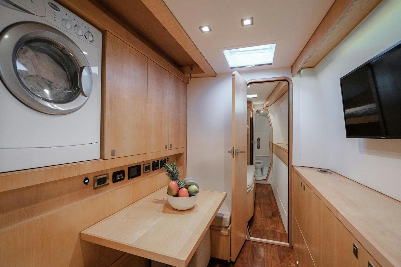 a kitchen with a table and a microwave aboard MY CAT Yacht for Sale