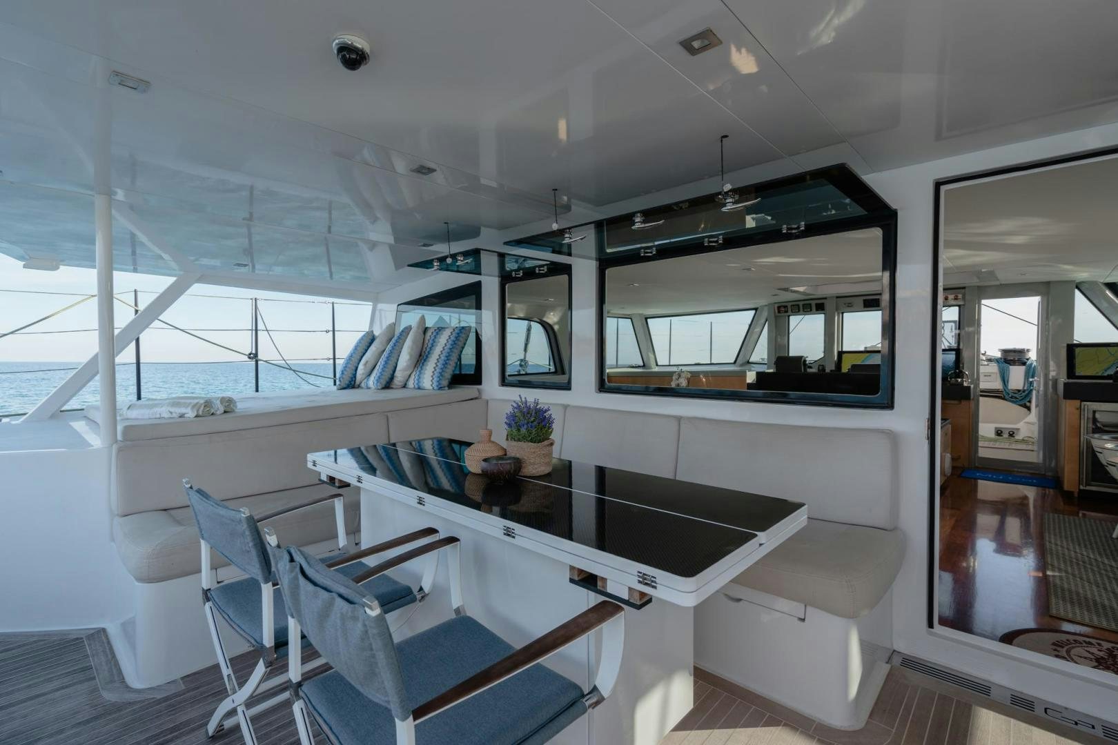 inside of a building with a table and chairs aboard MY CAT Yacht for Sale