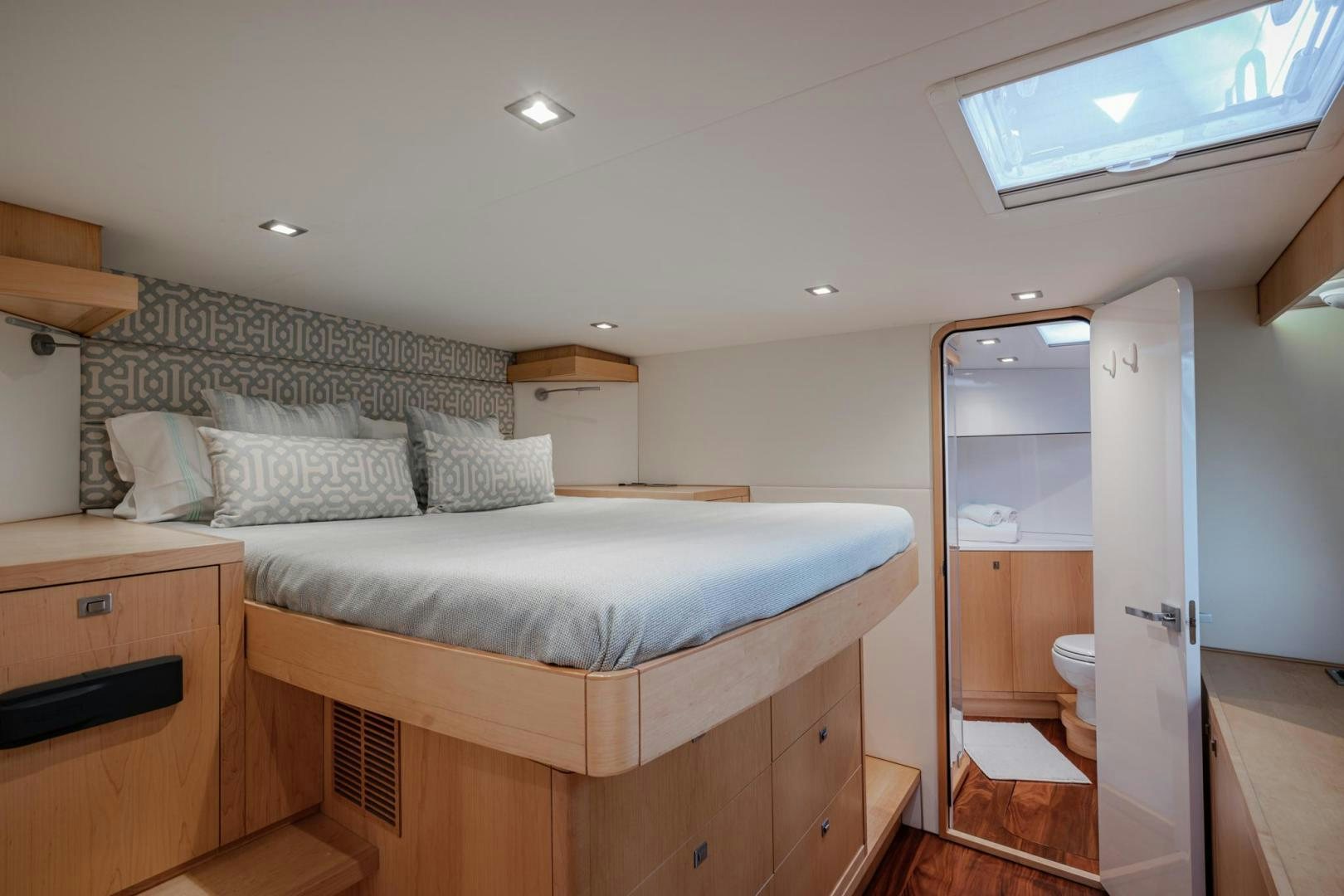 a bedroom with a bed and a closet aboard MY CAT Yacht for Sale