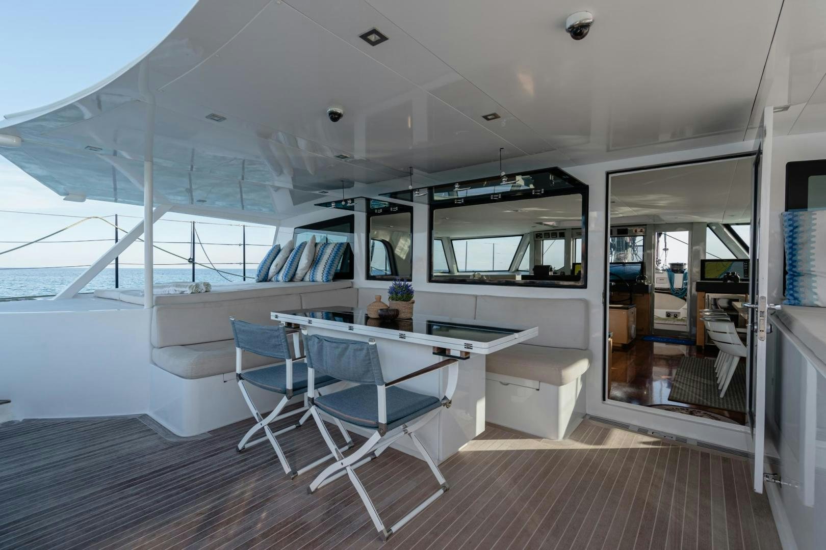 a boat with a desk and chairs aboard MY CAT Yacht for Sale