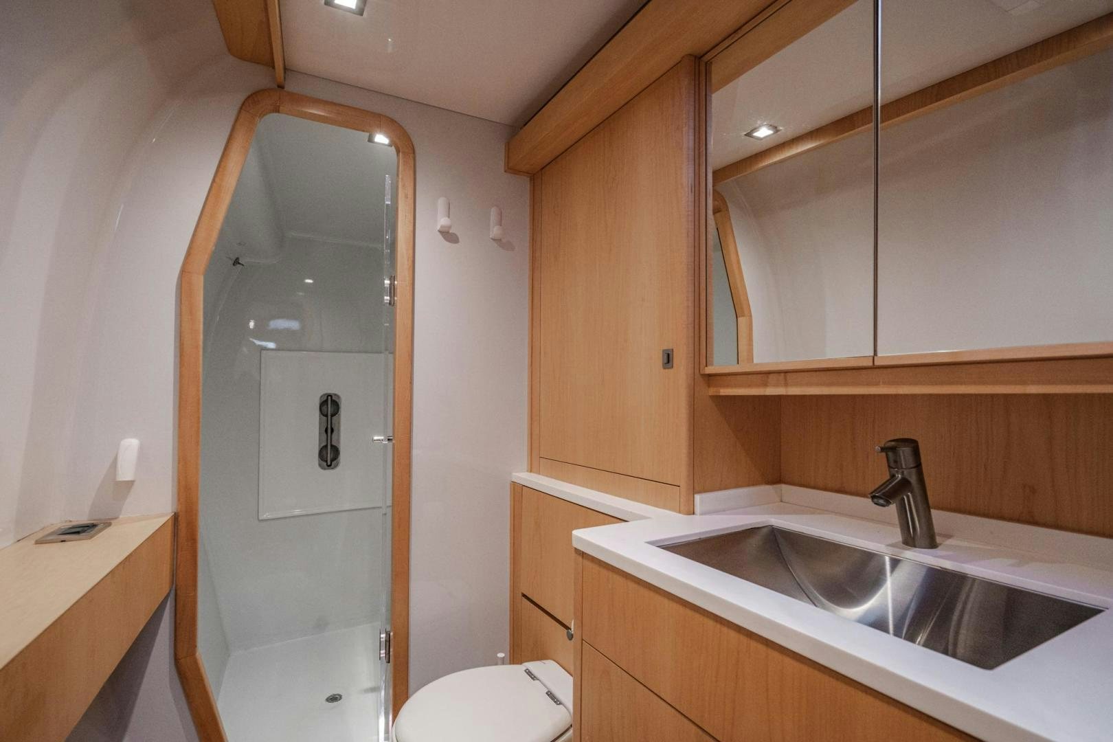 a bathroom with a shower sink and toilet aboard MY CAT Yacht for Sale