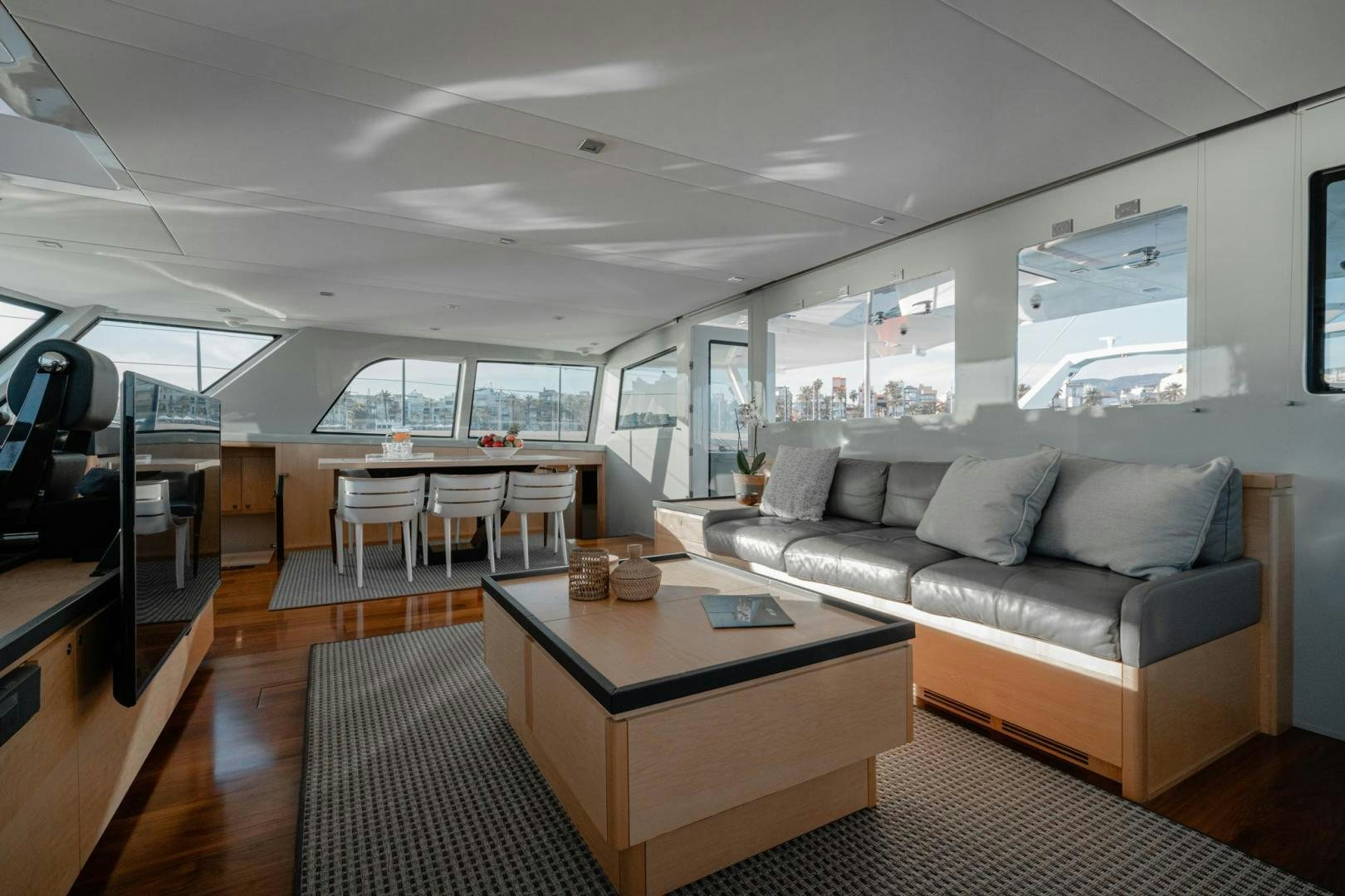 a living room with a couch and a table aboard MY CAT Yacht for Sale