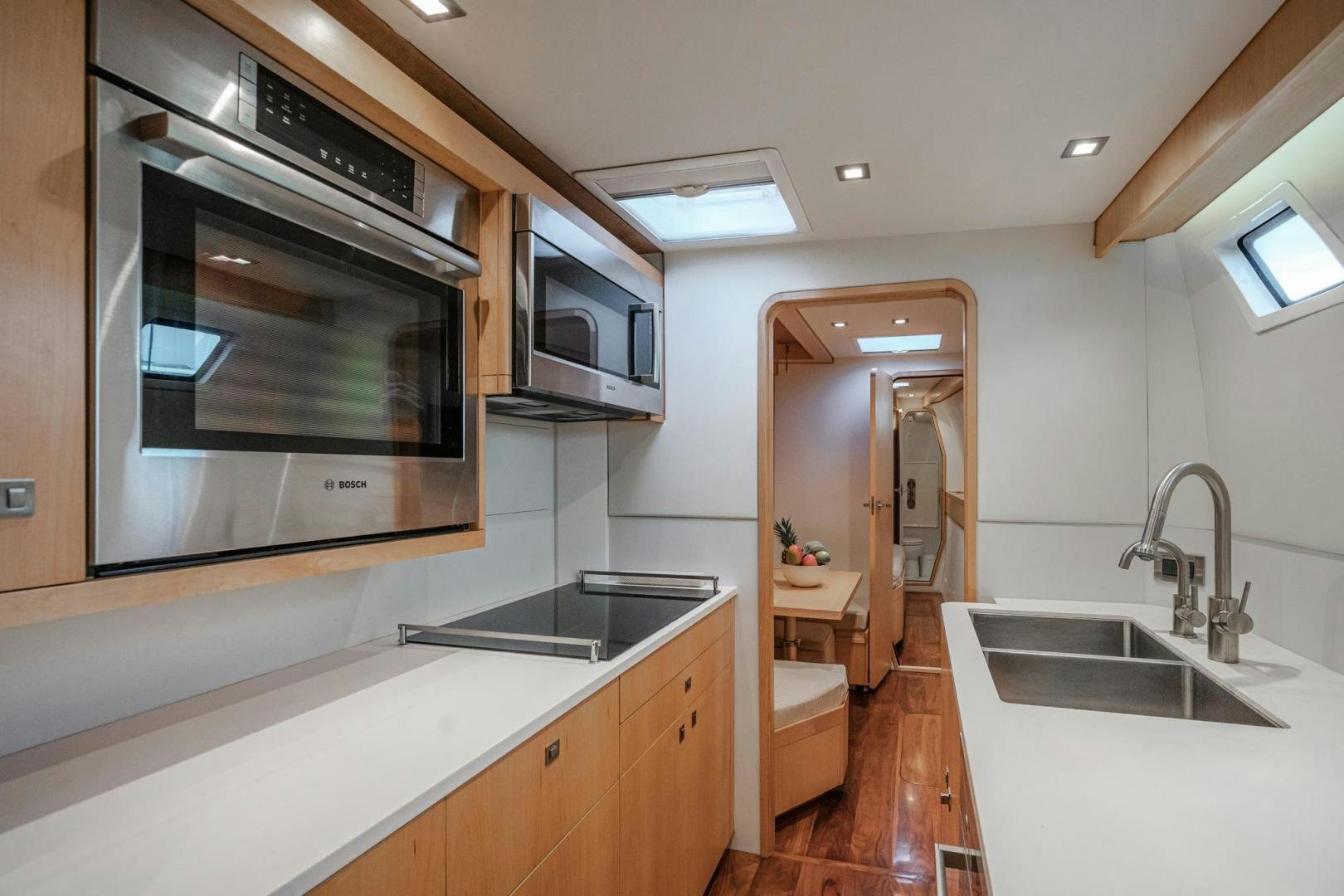 a kitchen with a sink and a microwave oven aboard MY CAT Yacht for Sale