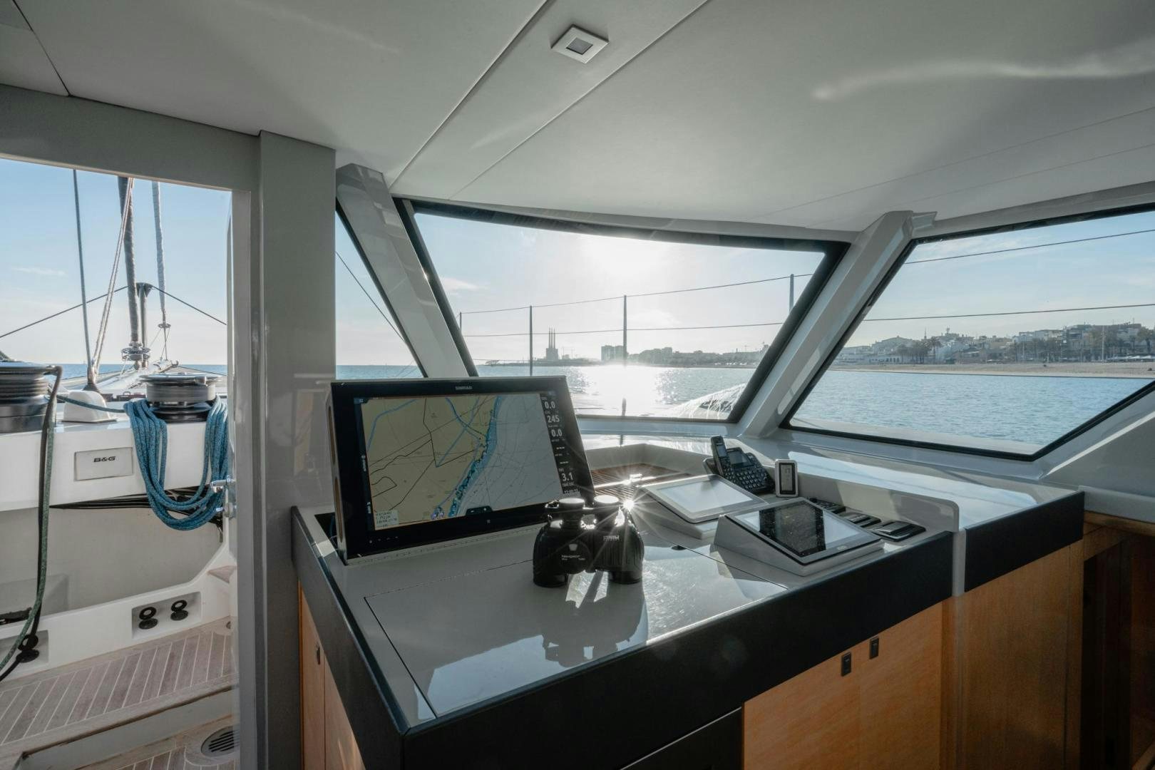 a boat with a monitor and a laptop on it aboard MY CAT Yacht for Sale
