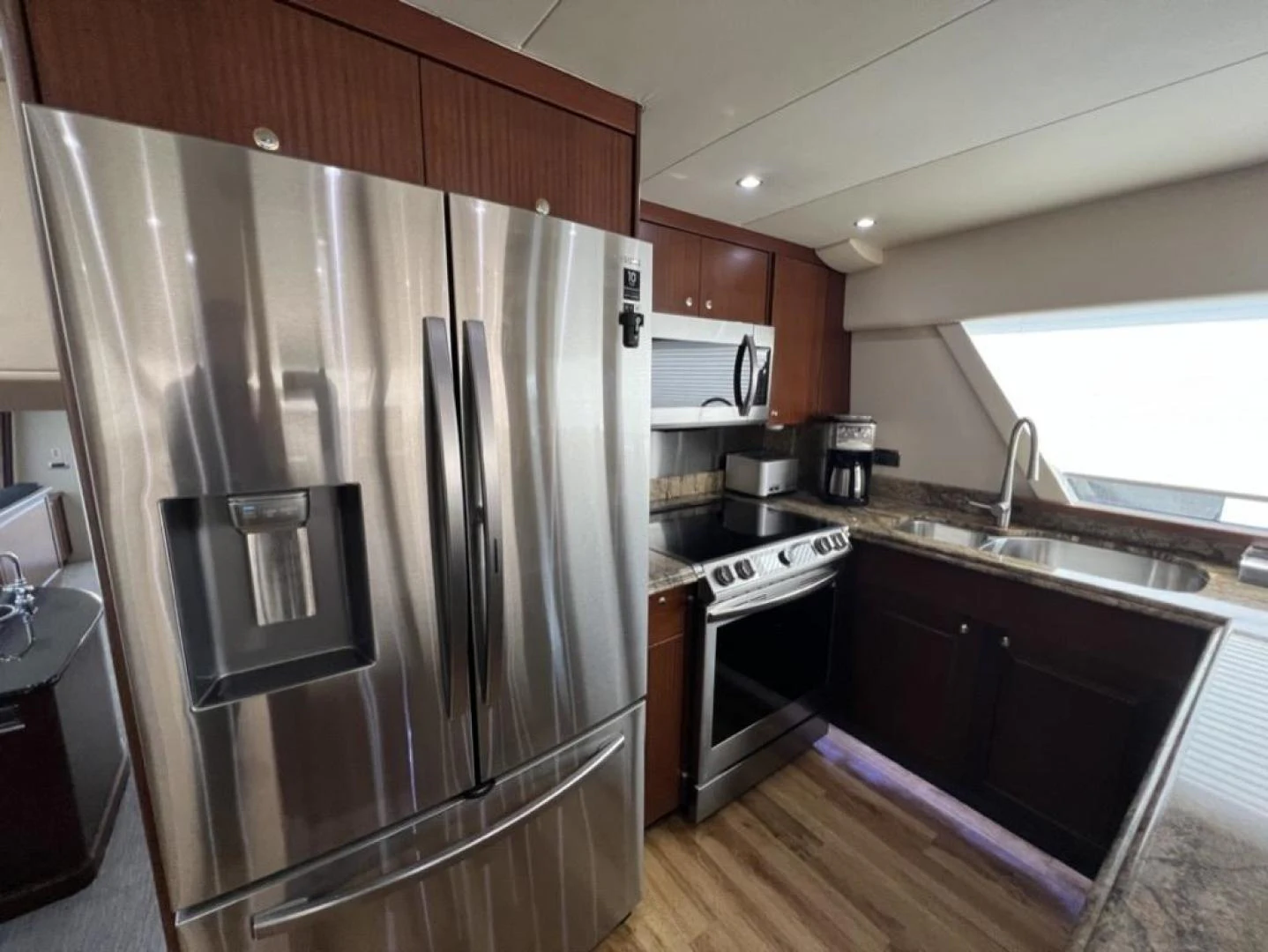 a kitchen with stainless steel appliances aboard SELQET Yacht for Sale
