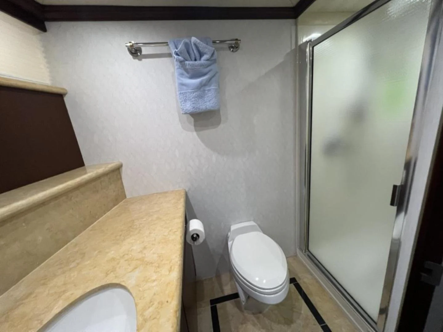 a bathroom with a toilet and a shower aboard SELQET Yacht for Sale