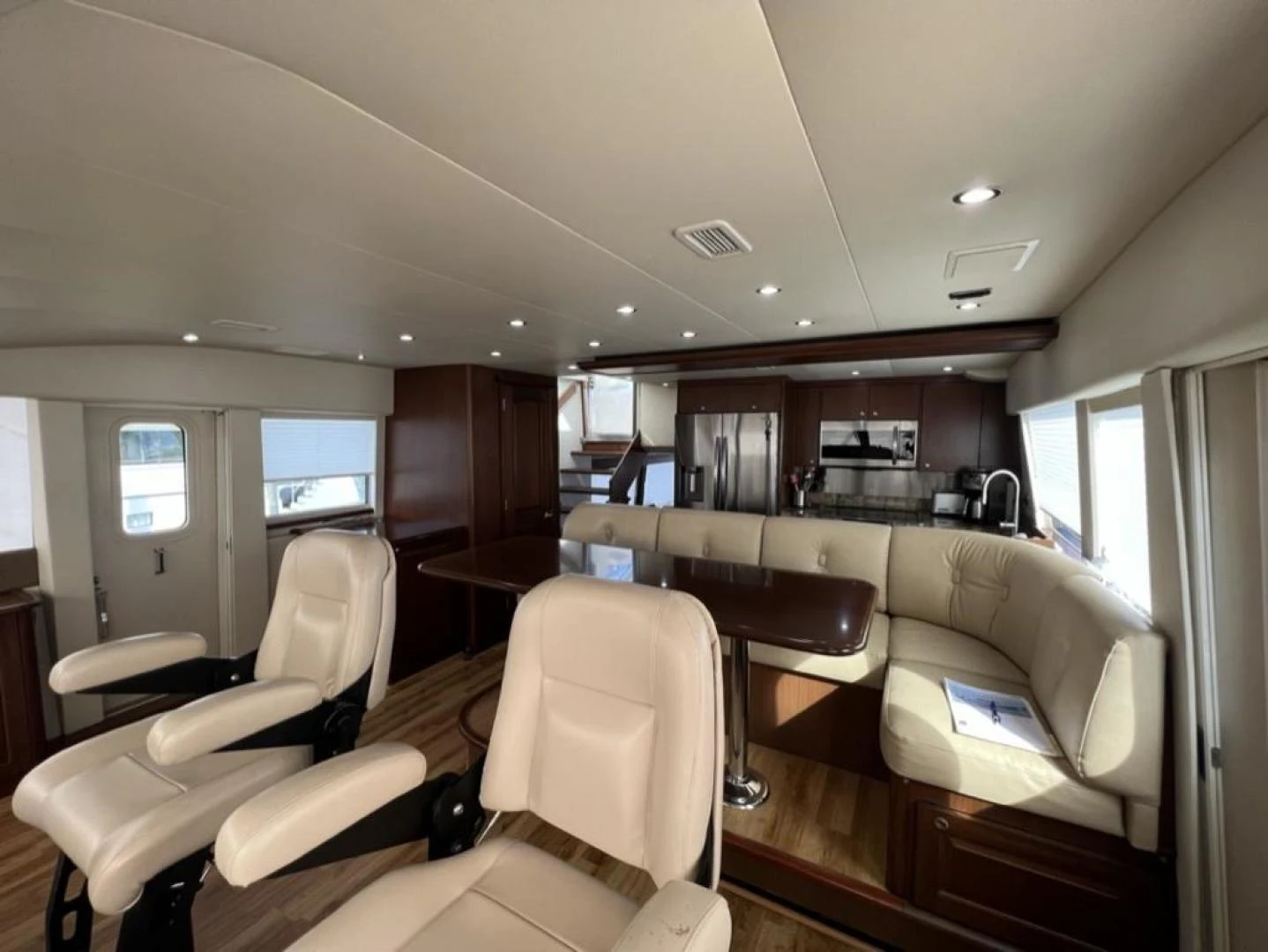 a room with chairs and a television aboard SELQET Yacht for Sale