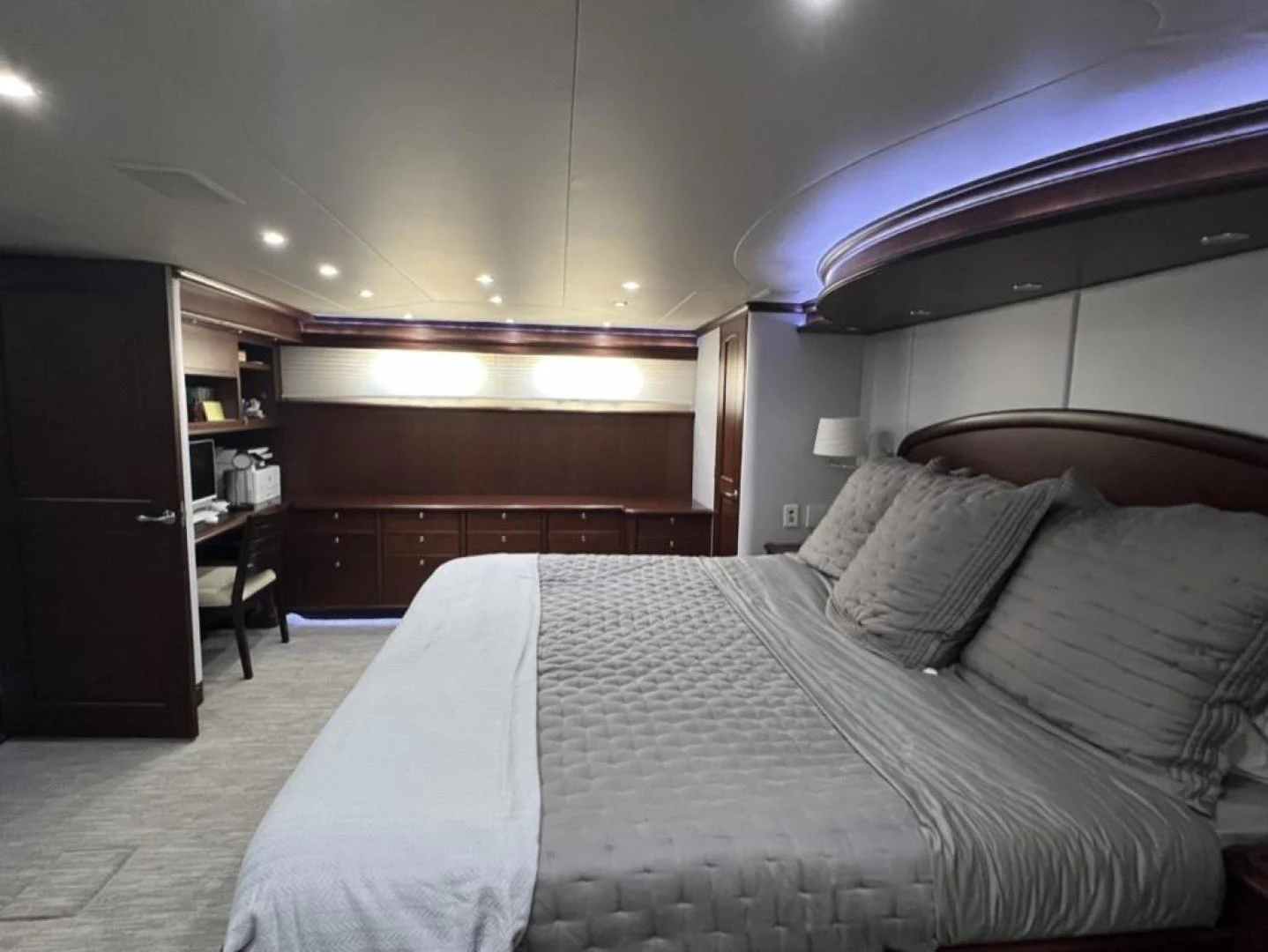 a bedroom with a bed and a desk aboard SELQET Yacht for Sale
