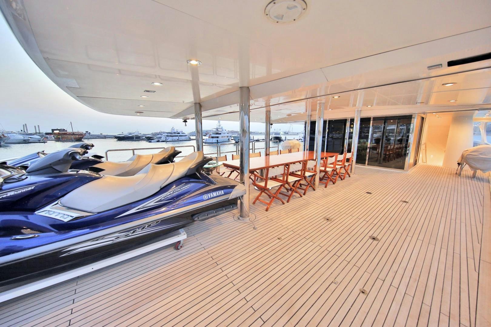 a deck with a large bed aboard SOJO Yacht for Sale