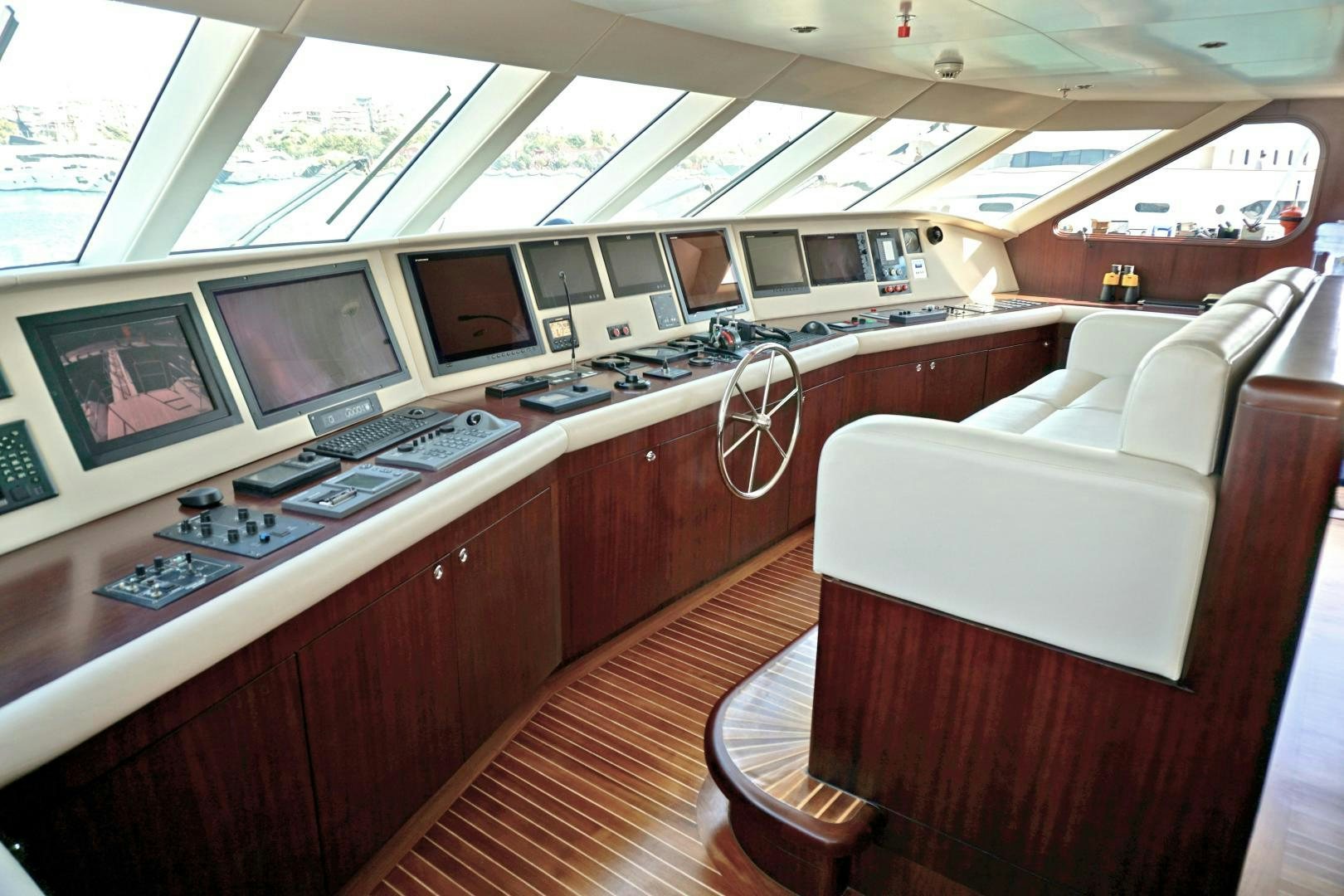 a room with a desk and computers aboard SOJO Yacht for Sale