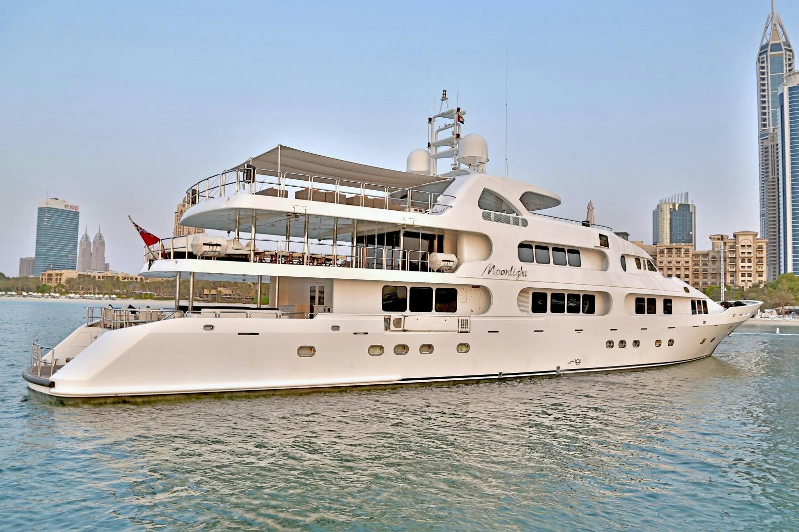 a large white boat in the water aboard SOJO Yacht for Sale
