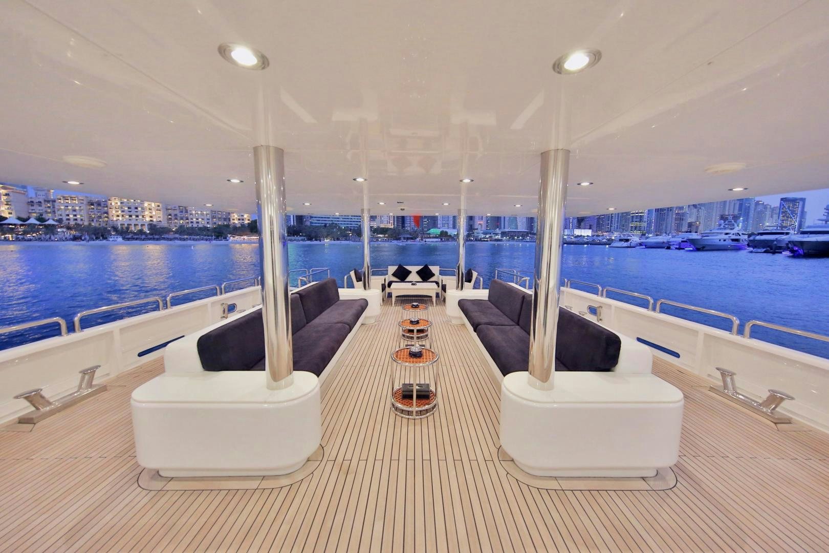 a room with a couch and a pool aboard SOJO Yacht for Sale