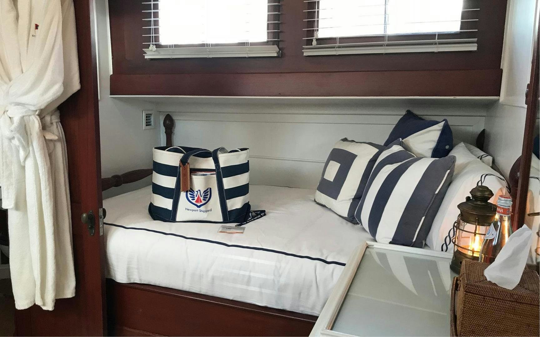 a bed with pillows and pillows aboard SCOUT Yacht for Sale