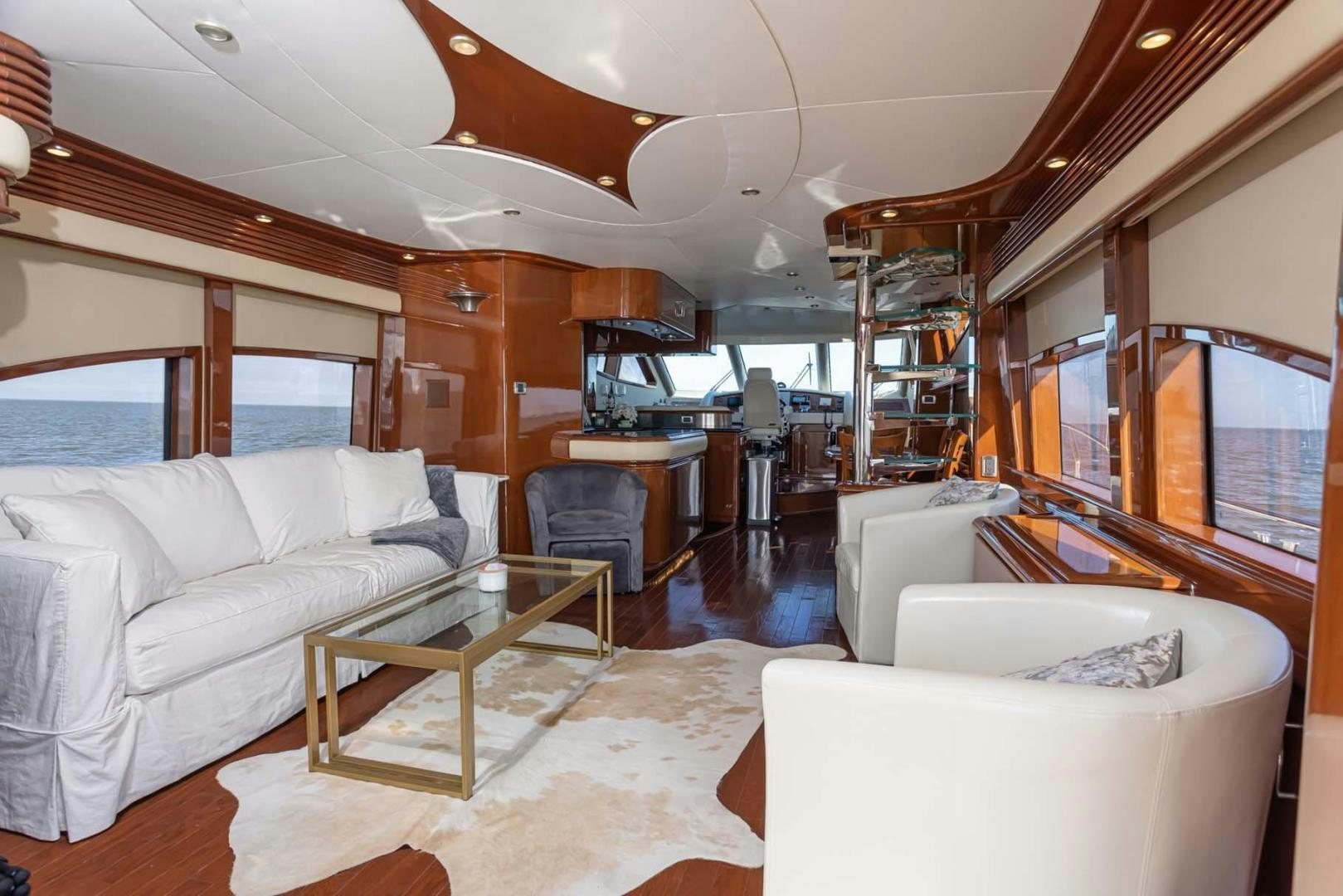 a living room with a large mirror aboard DECKED OUT Yacht for Sale