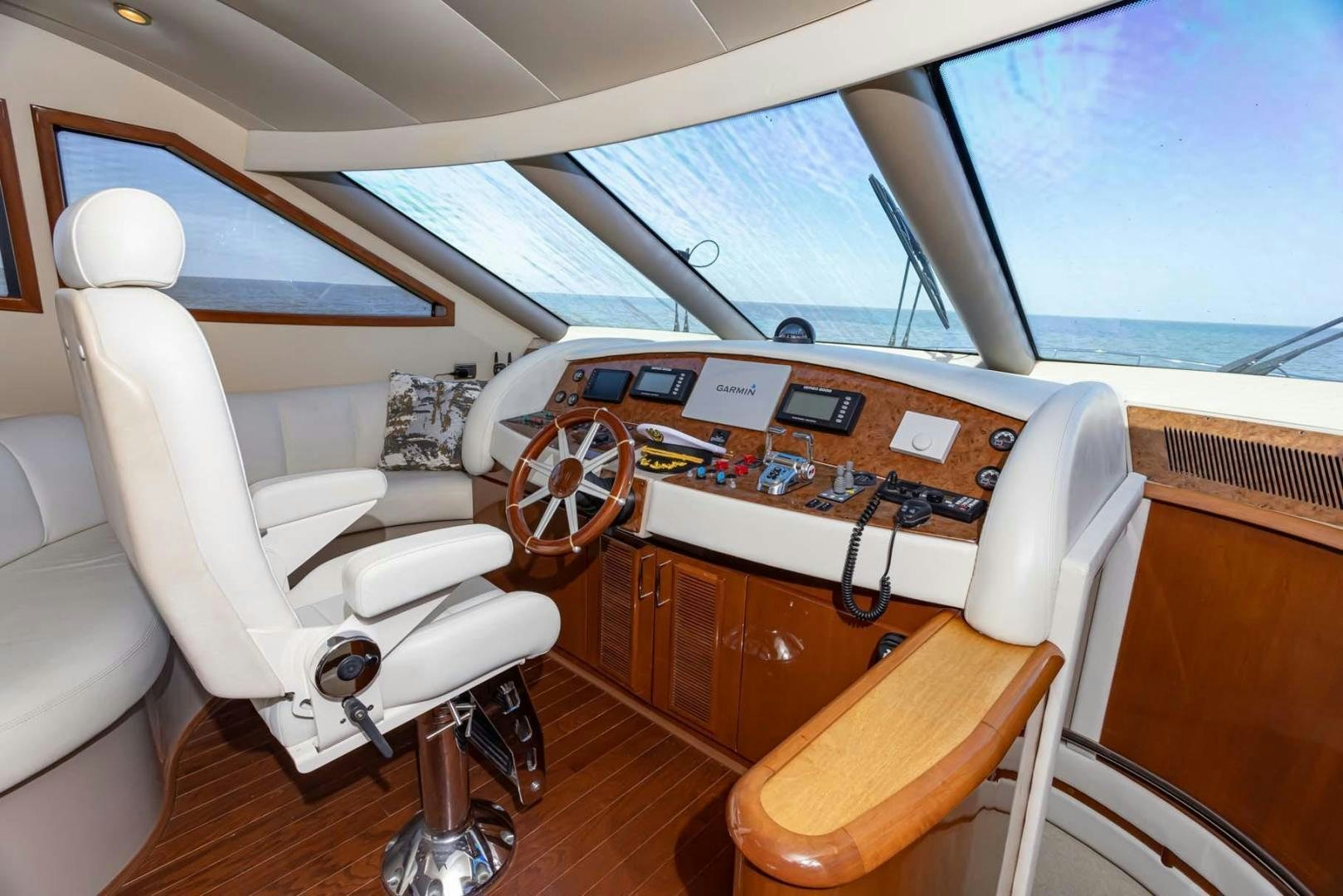 a table with chairs and a desk aboard DECKED OUT Yacht for Sale