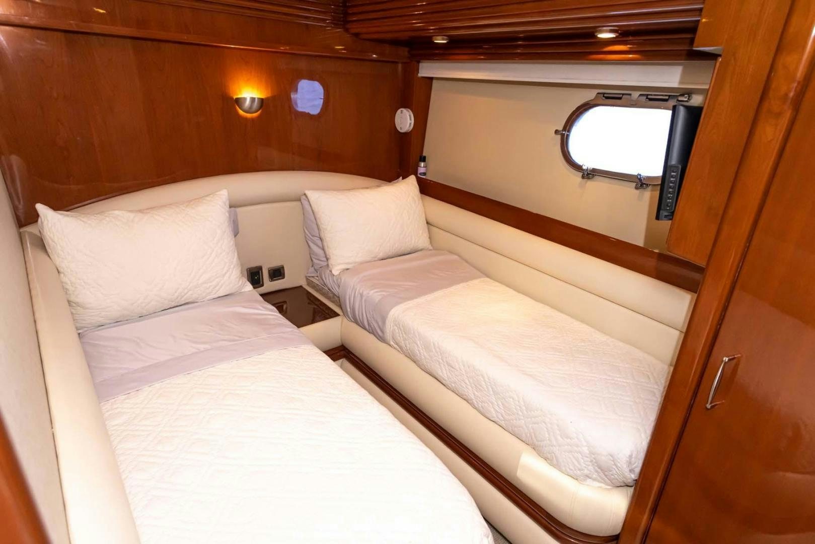 a couple of beds in a cabin aboard DECKED OUT Yacht for Sale