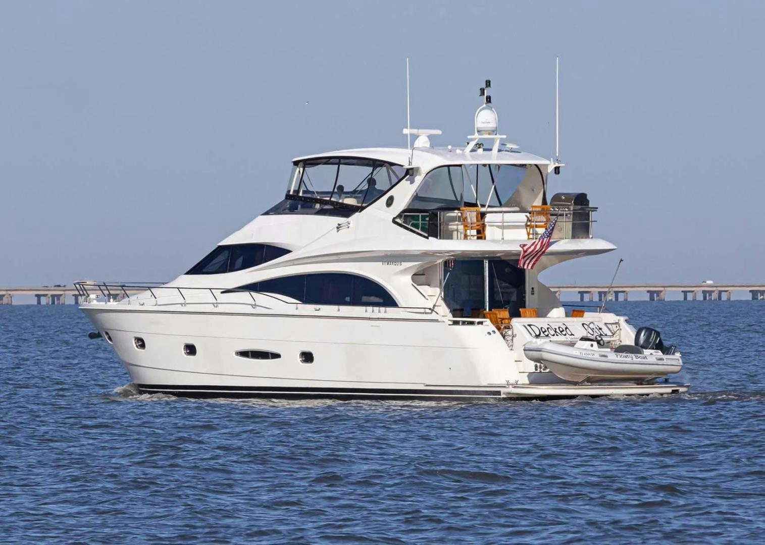 a white yacht in the water aboard DECKED OUT Yacht for Sale