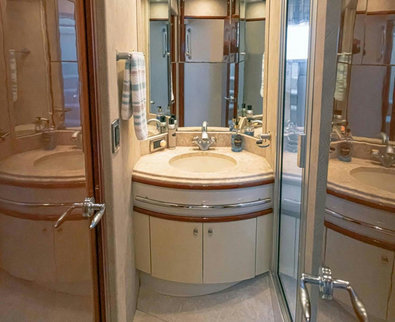 a bathroom with a sink and a mirror aboard DECKED OUT Yacht for Sale