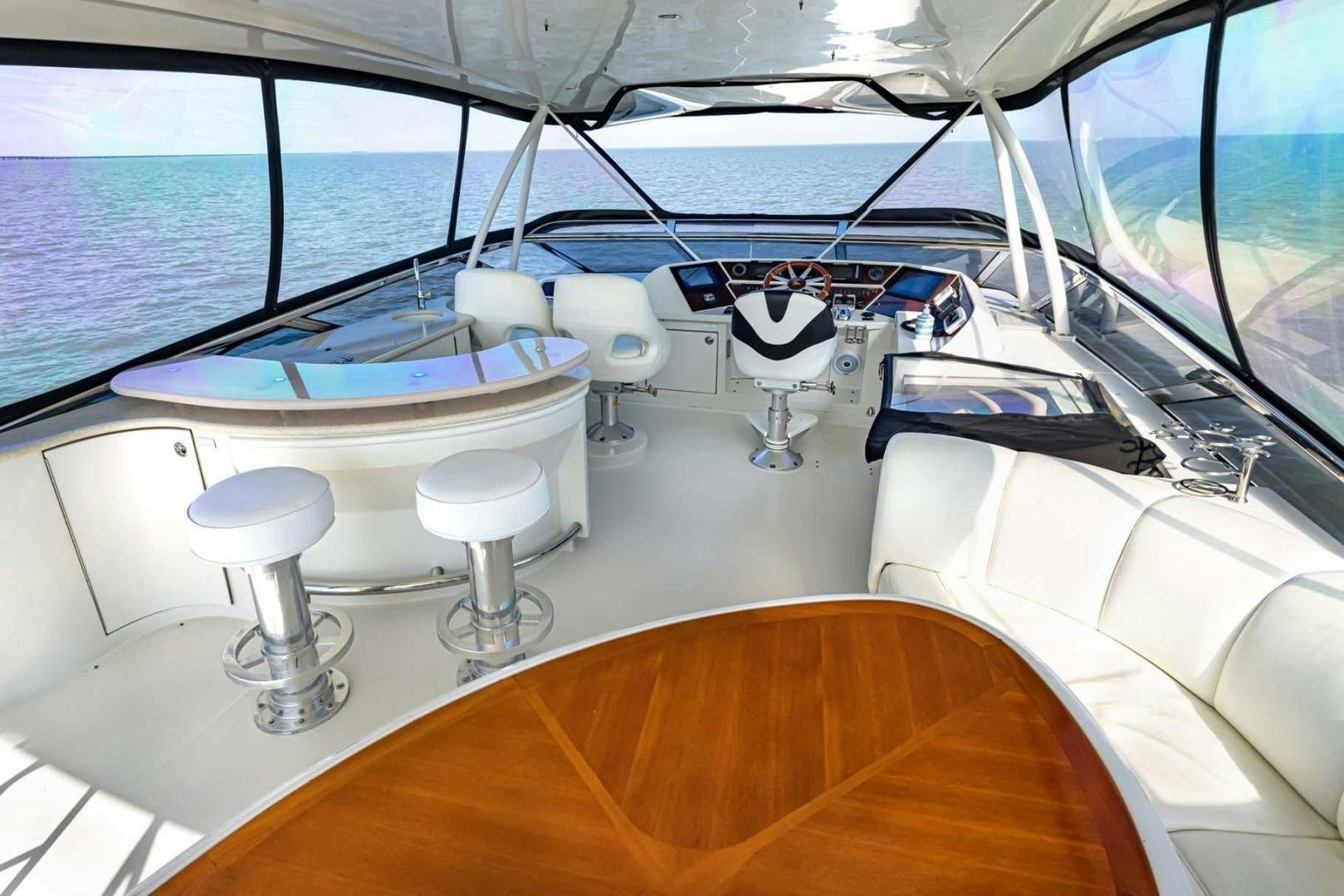 a boat with a table and chairs aboard DECKED OUT Yacht for Sale