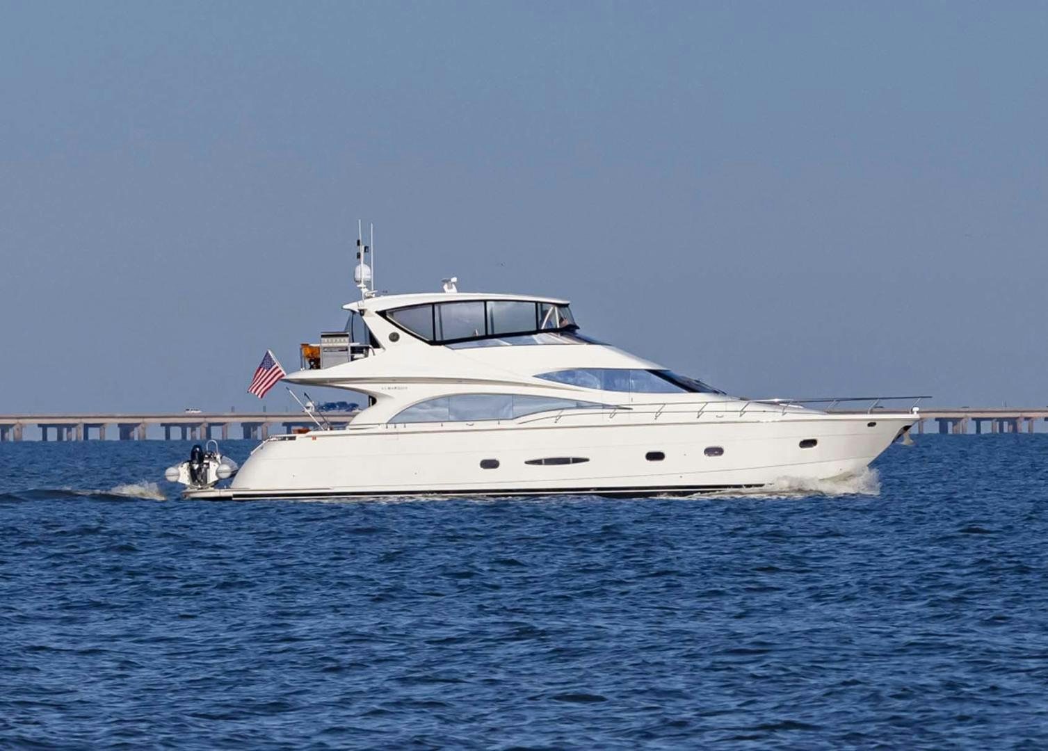a white yacht on the water aboard DECKED OUT Yacht for Sale
