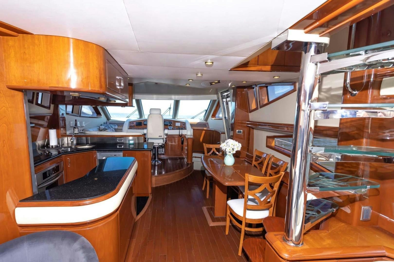 a room with a table and chairs aboard DECKED OUT Yacht for Sale