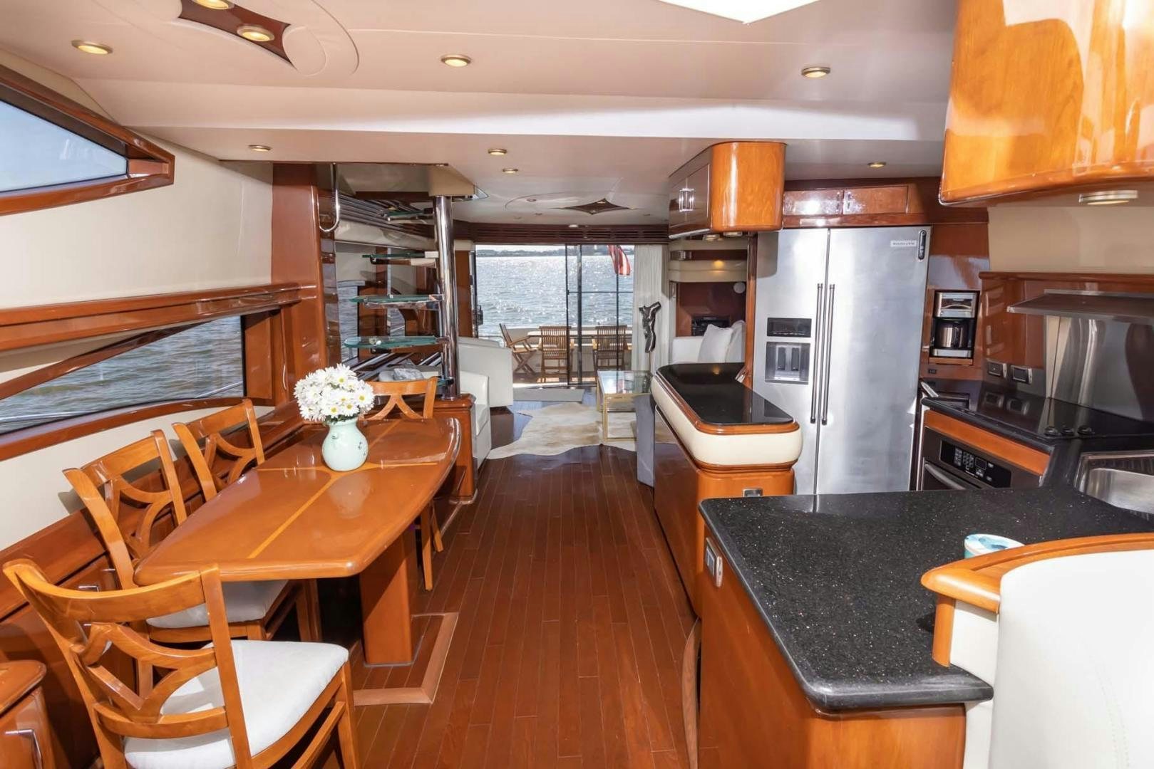 a kitchen with a dining area aboard DECKED OUT Yacht for Sale