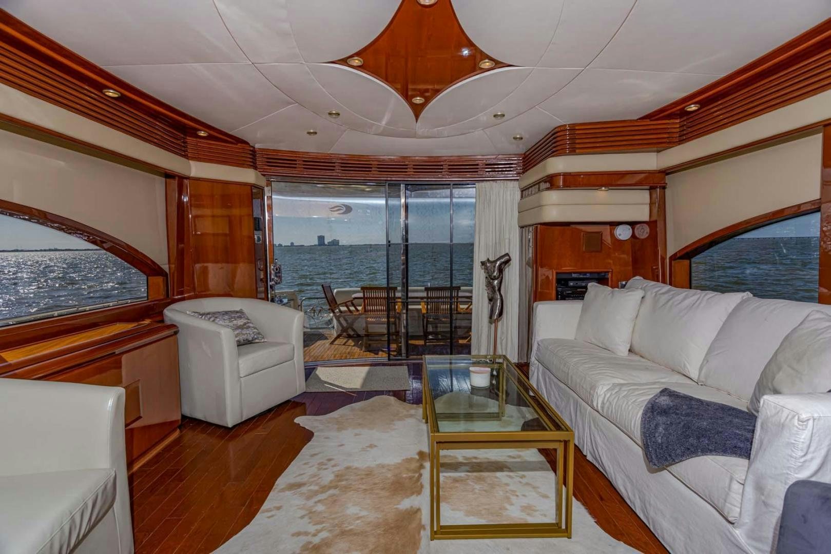 a living room with a large glass door aboard DECKED OUT Yacht for Sale