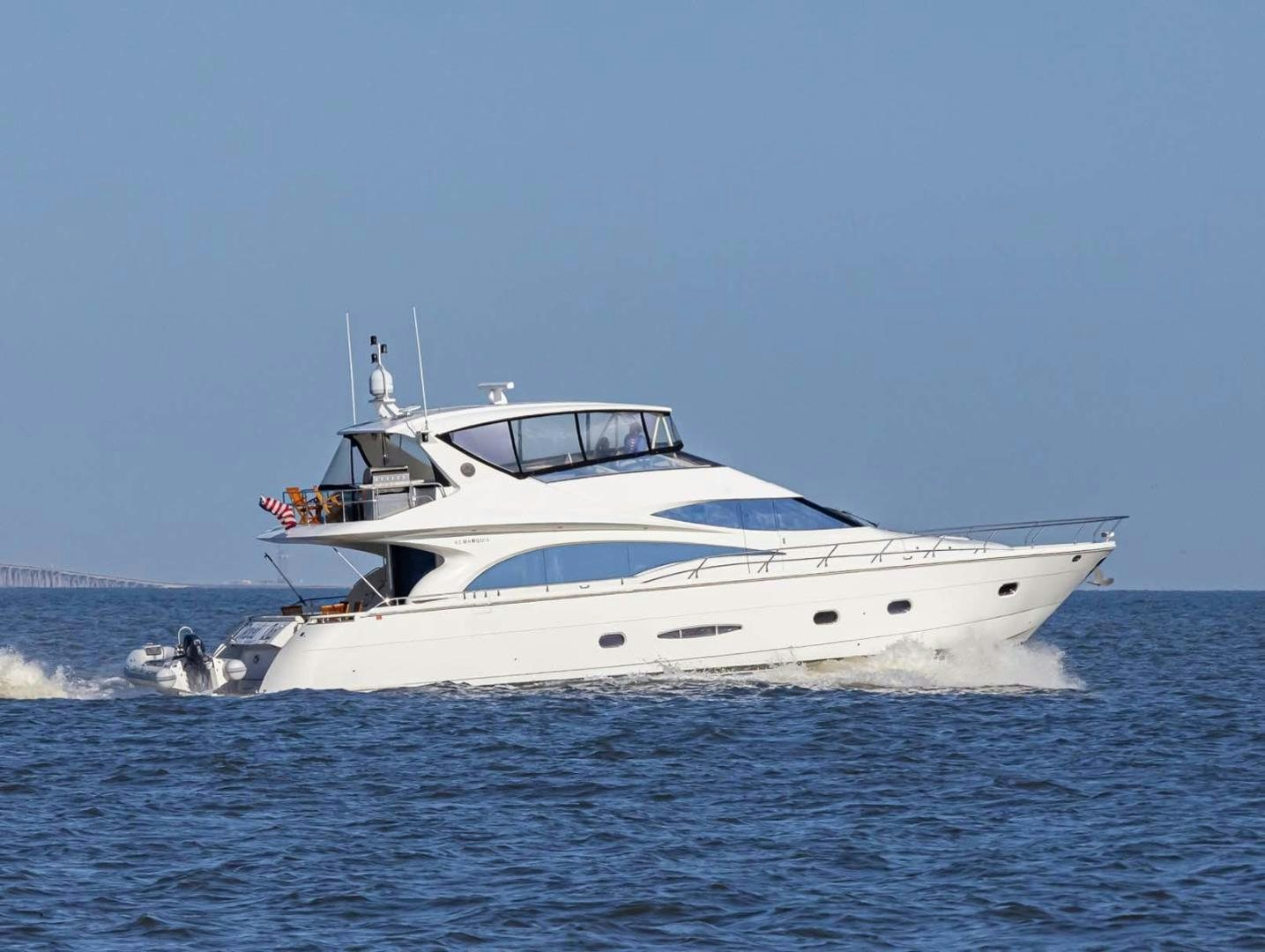 a white yacht in the water aboard DECKED OUT Yacht for Sale