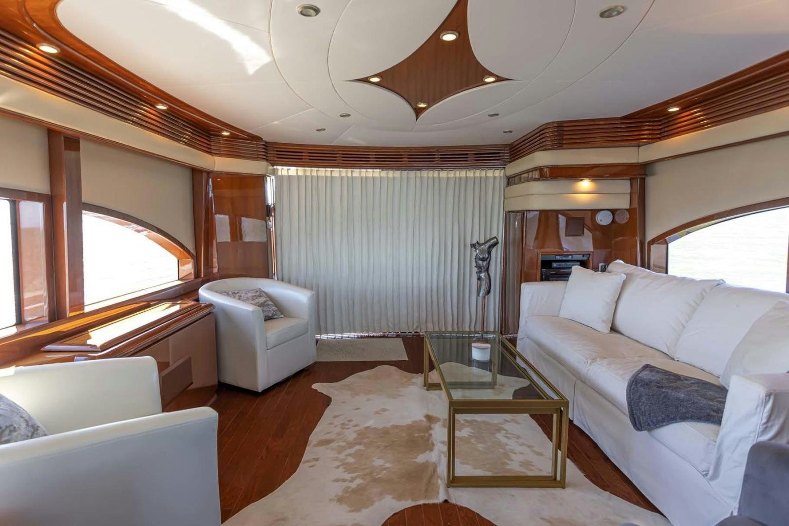 a large living room with a large window aboard DECKED OUT Yacht for Sale