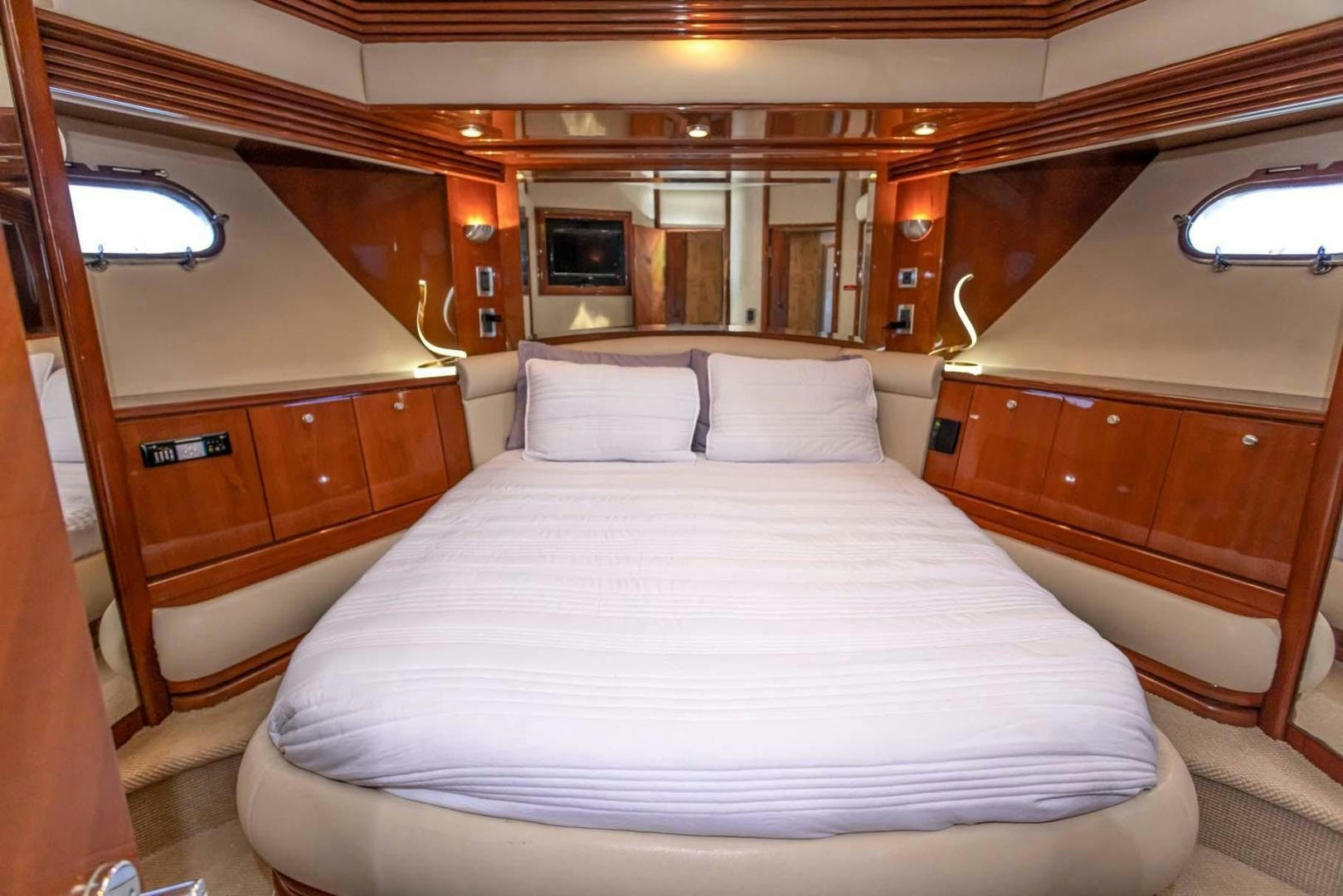 a bed in a cabin aboard DECKED OUT Yacht for Sale