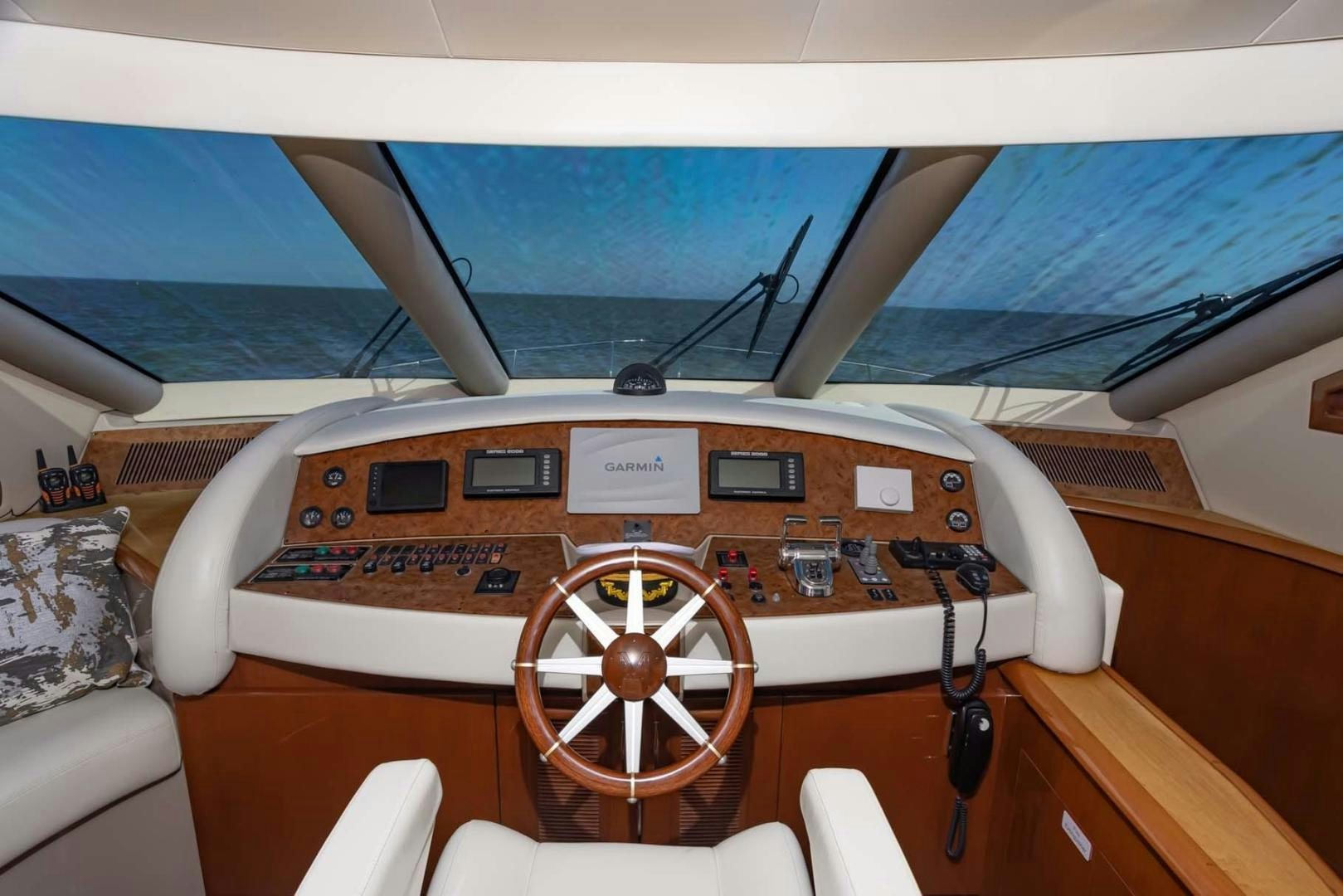 a wooden airplane with a seat and steering wheel on a boat aboard DECKED OUT Yacht for Sale