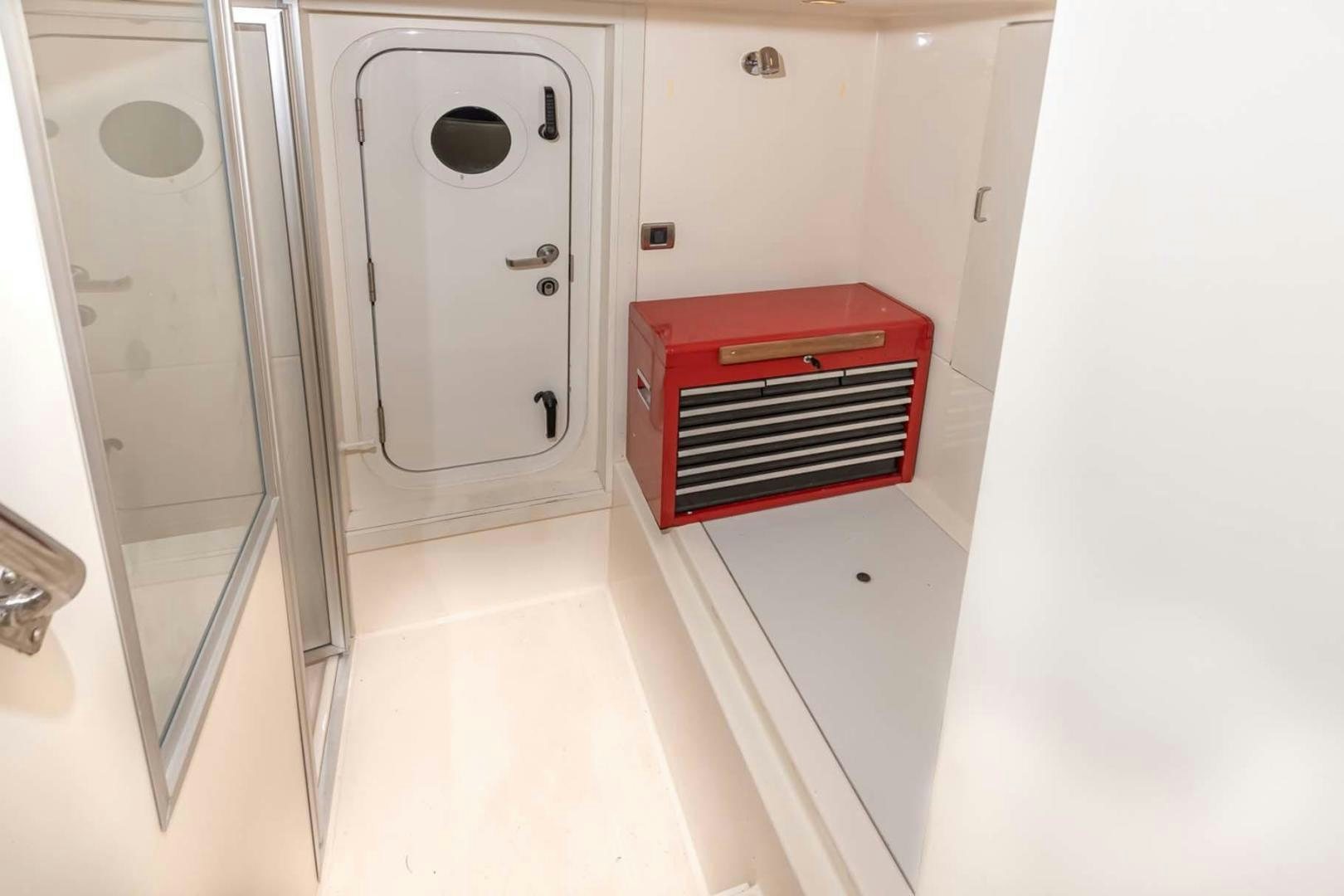 a white room with a red and white machine aboard DECKED OUT Yacht for Sale