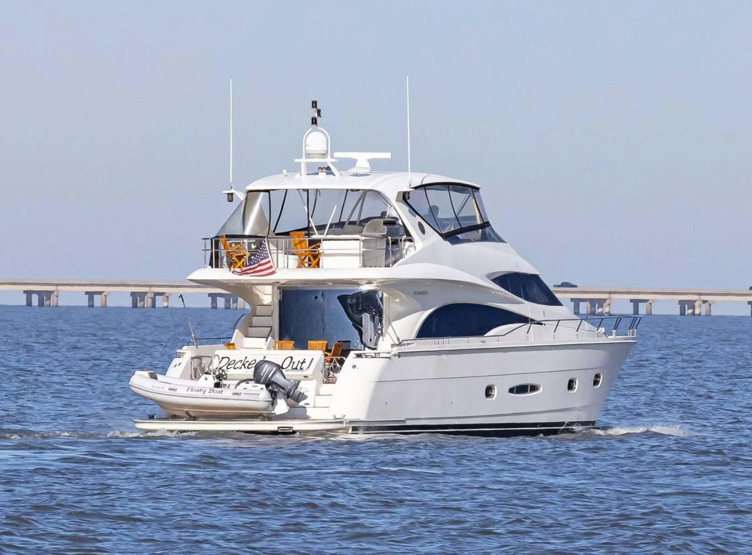 a white boat in the water aboard DECKED OUT Yacht for Sale
