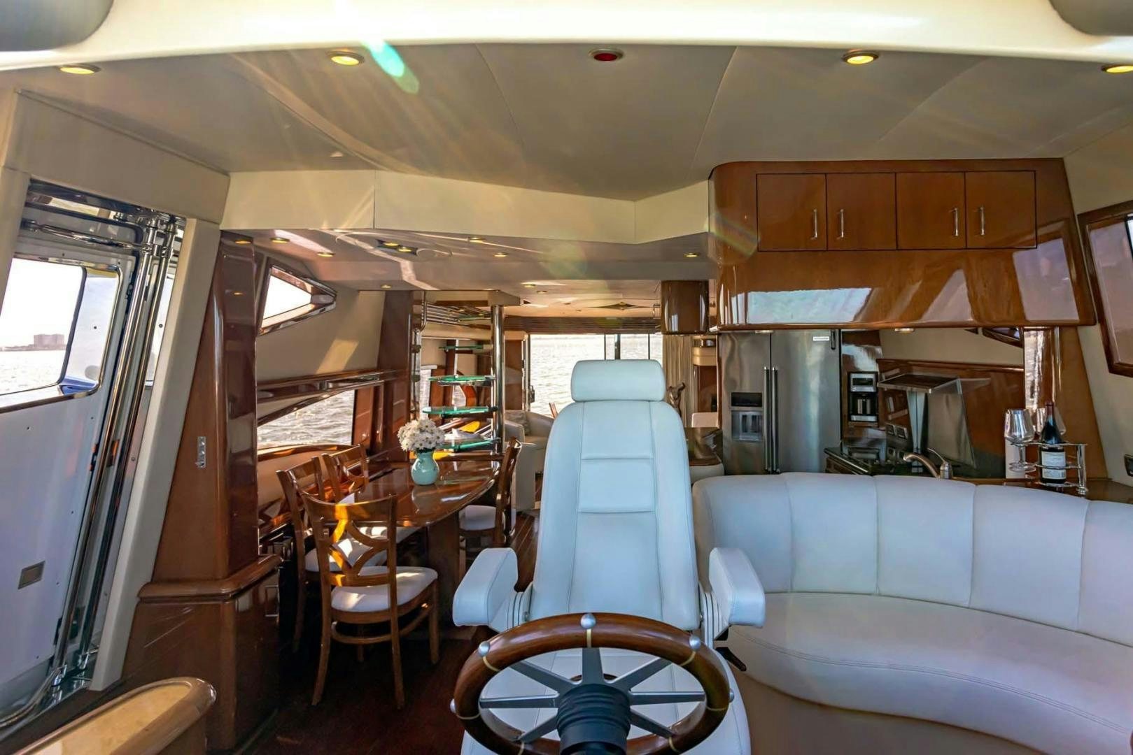 a small kitchen with a dining table aboard DECKED OUT Yacht for Sale