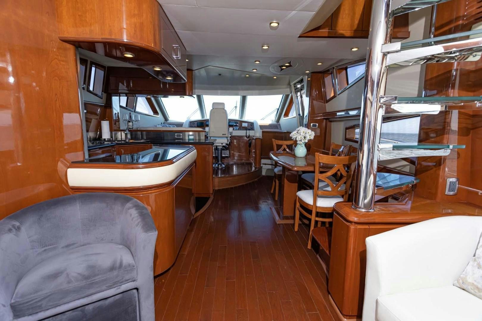 a room with a wood floor and a wood floor with a wood floor aboard DECKED OUT Yacht for Sale