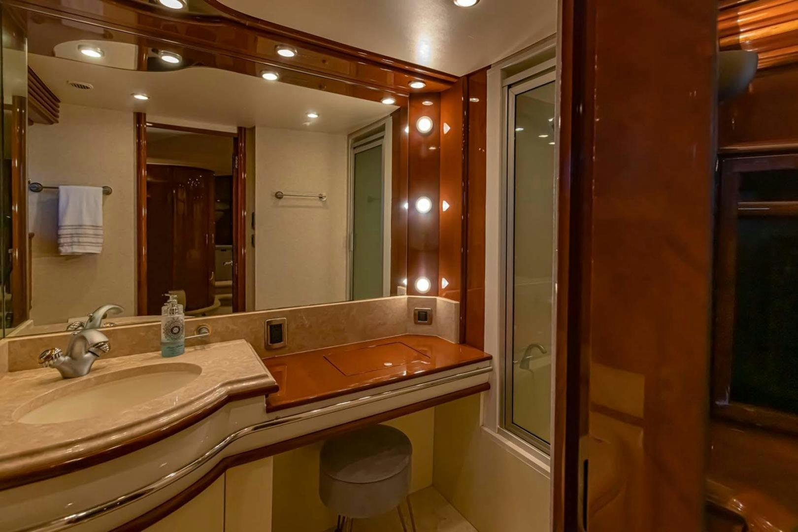 a bathroom with a large mirror aboard DECKED OUT Yacht for Sale